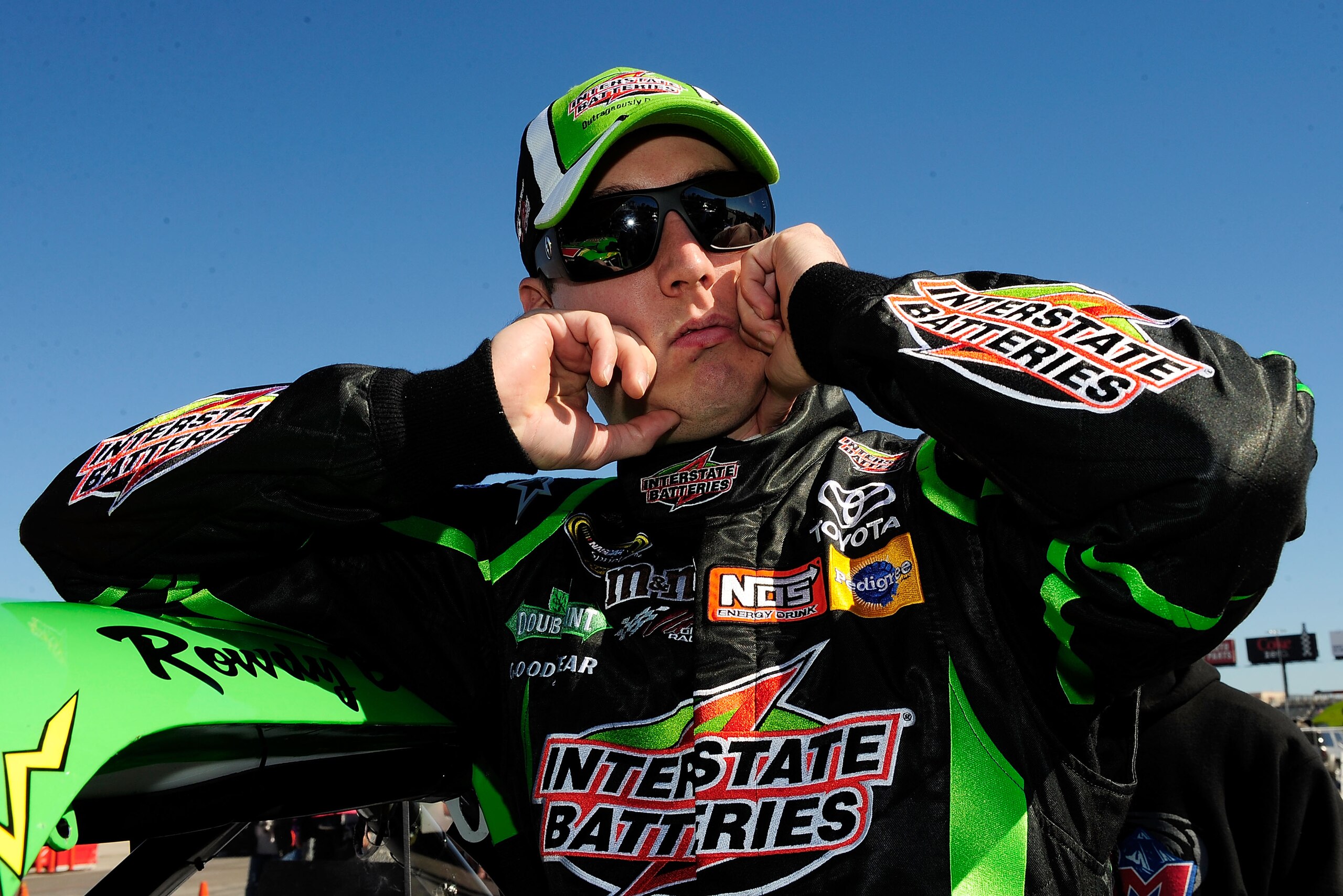 FORT WORTH, TX - NOVEMBER 04:  Kyle Busch, driver of the #18 Interstate Batteries Toyota, stands by his truck during practice for the NASCAR Camping World Truck Series WinStar World Casino 350k at Texas Motor Speedway on November 4, 2010 in Fort Worth, Te