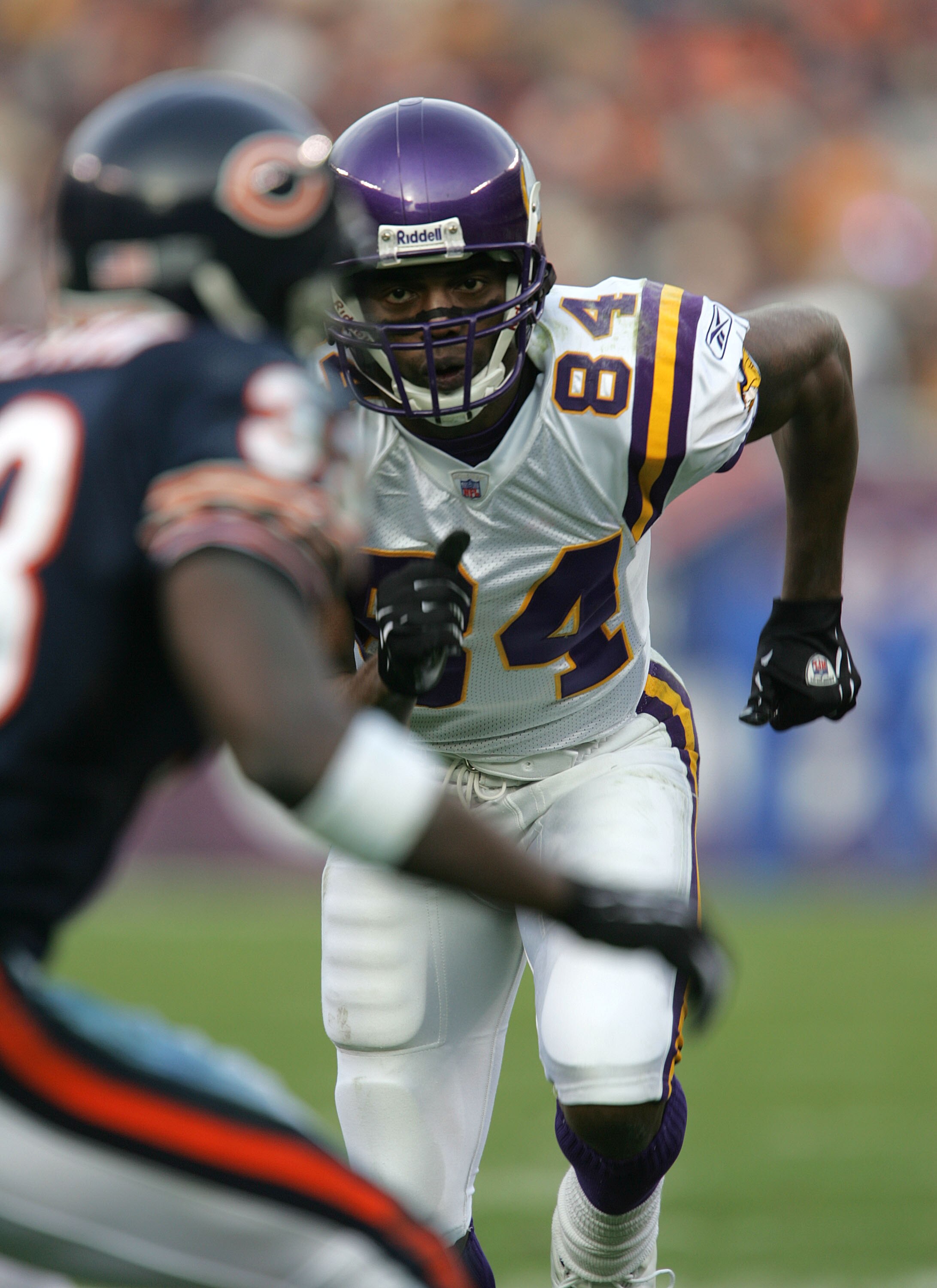 CHICAGO - DECEMBER 05: Randy Moss #84 of the Minnesota Vikings looks to get by Charles Tillman #33 of the Chicago Bears while running  a pass route during a game on December 5, 2004 at Soldier Field in Chicago, Illinois. (Photo by Jonathan Daniel/Getty Im