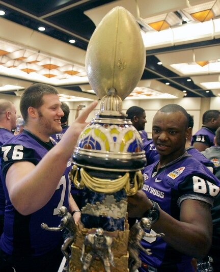 Didn't someone tell them it's bad luck to touch it before you win it?