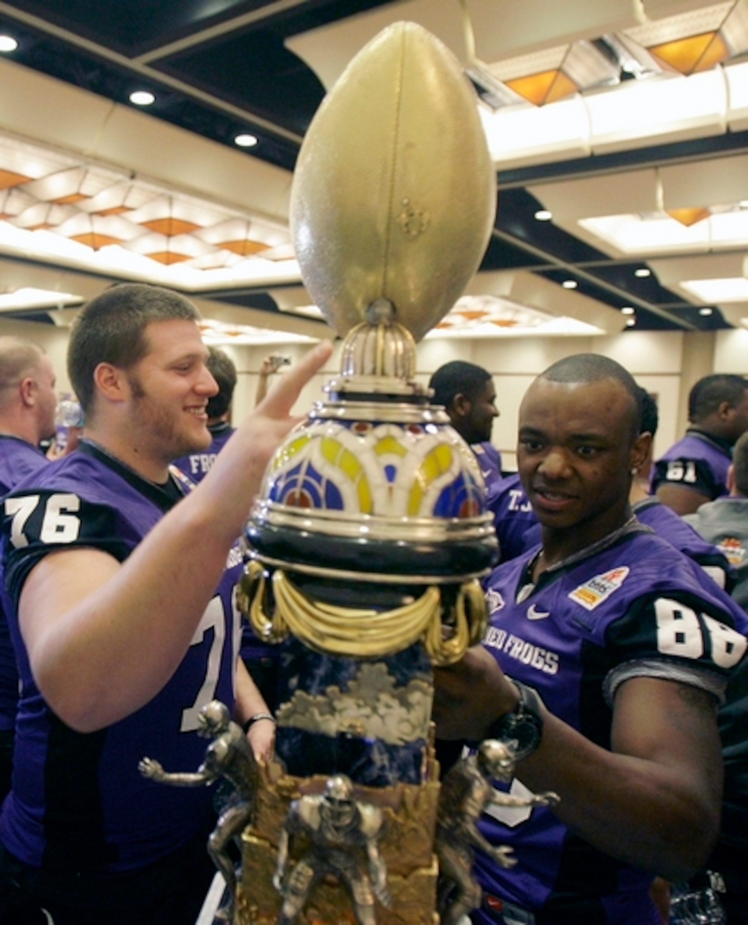 Didn't someone tell them it's bad luck to touch it before you win it?