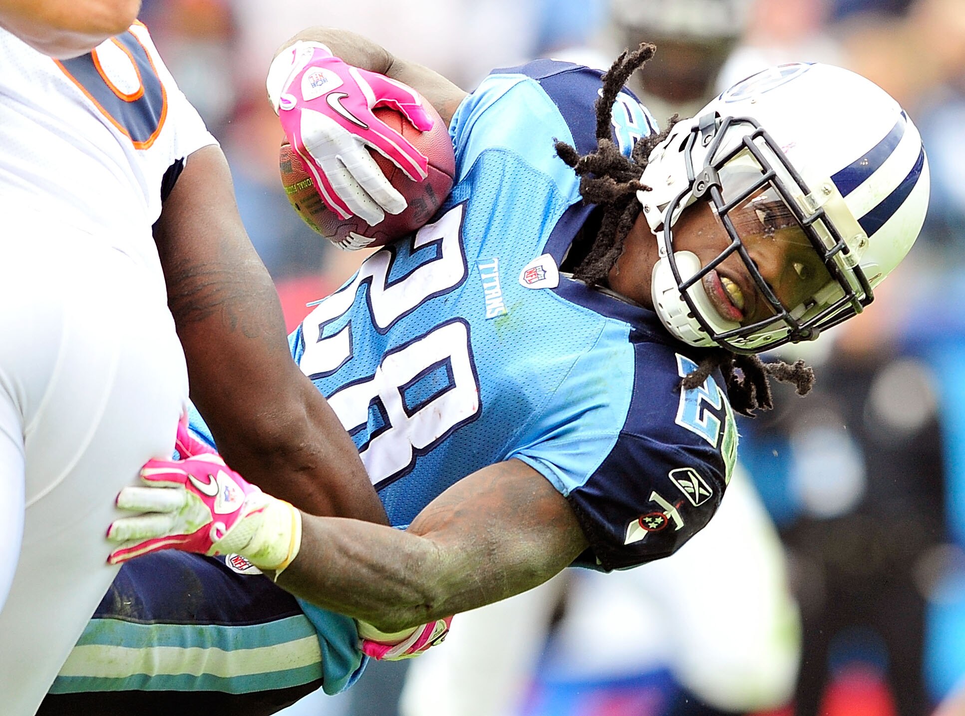 NASHVILLE, TN - OCTOBER 03:  Chris Johnson #28 of the Tennessee Titans stretches for extra yards against the Denver Broncos at LP Field on October 3, 2010 in Nashville, Tennessee. Denver won 26-20.  (Photo by Grant Halverson/Getty Images)