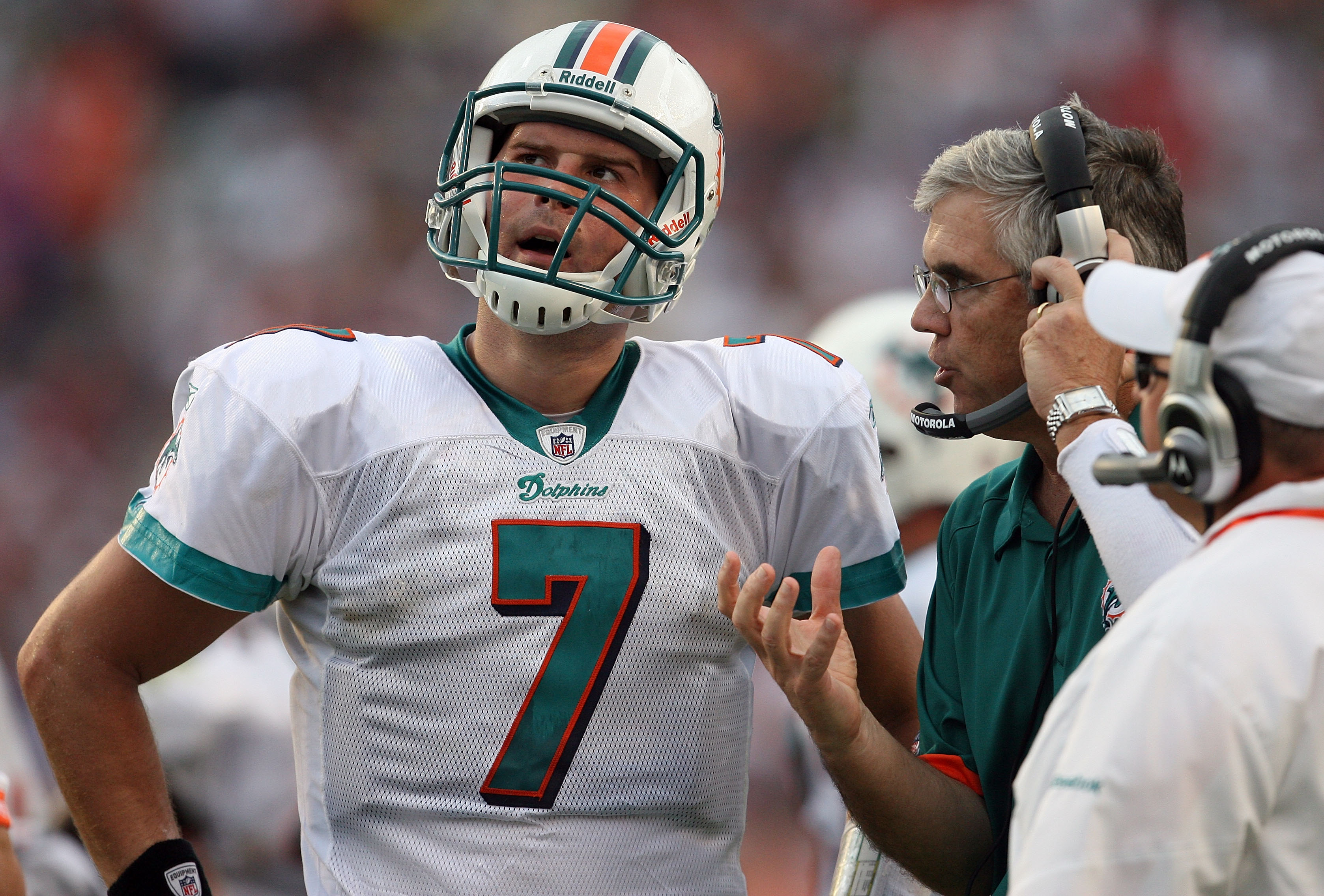 MIAMI - DECEMBER 06:  Quarterback Chad Henne #7 of the Miami Dolphins talks with offensive coordinator Dan Henning and head coach Tony Sparano late in the game against the New England Patriots at Land Shark Stadium on December 6, 2009 in Miami, Florida. T