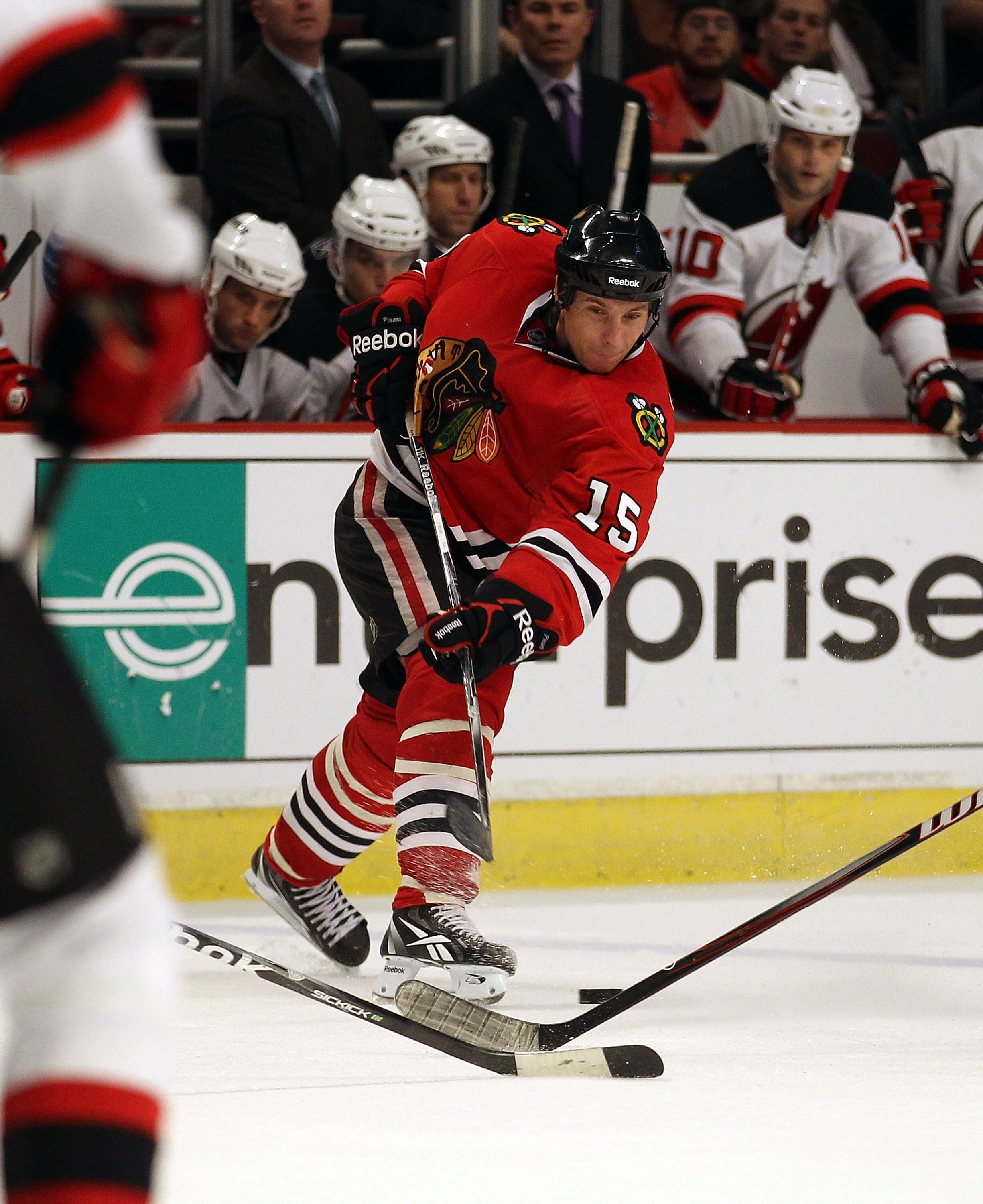 CHICAGO - NOVEMBER 03: Fernando Pisani #15 of the Chicago Blackhawks shoots the puck against the New Jersey Devils at the United Center on November 3, 2010 in Chicago, Illinois. The Devils defeated the Blackhawks 5-3. (Photo by Jonathan Daniel/Getty Image