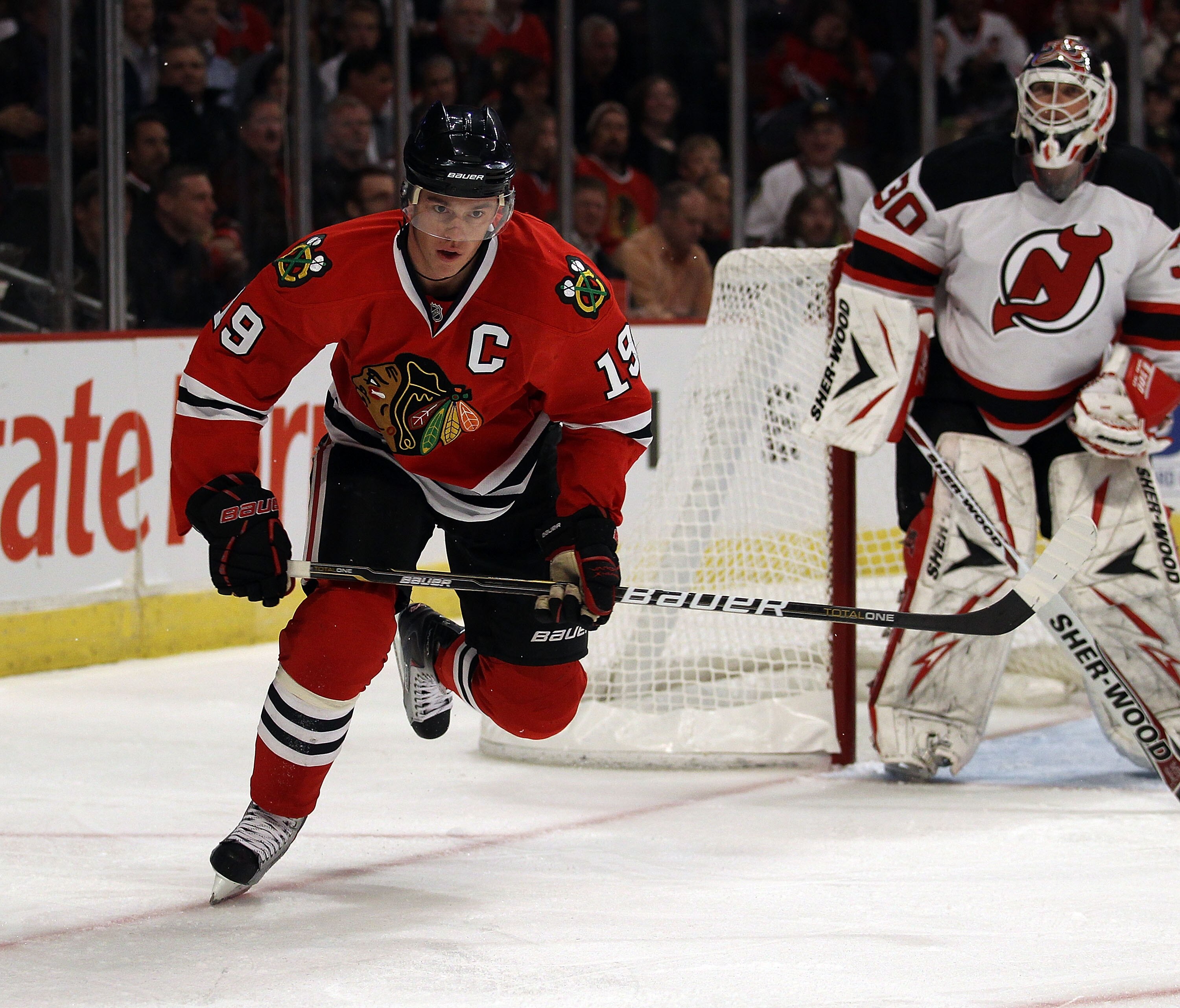 CHICAGO - NOVEMBER 03: Jonathan Toews #19 of the Chicago Blackhawks skates to the puck against the New Jersey Devils at the United Center on November 3, 2010 in Chicago, Illinois. The Devils defeated the Blackhawks 5-3. (Photo by Jonathan Daniel/Getty Ima