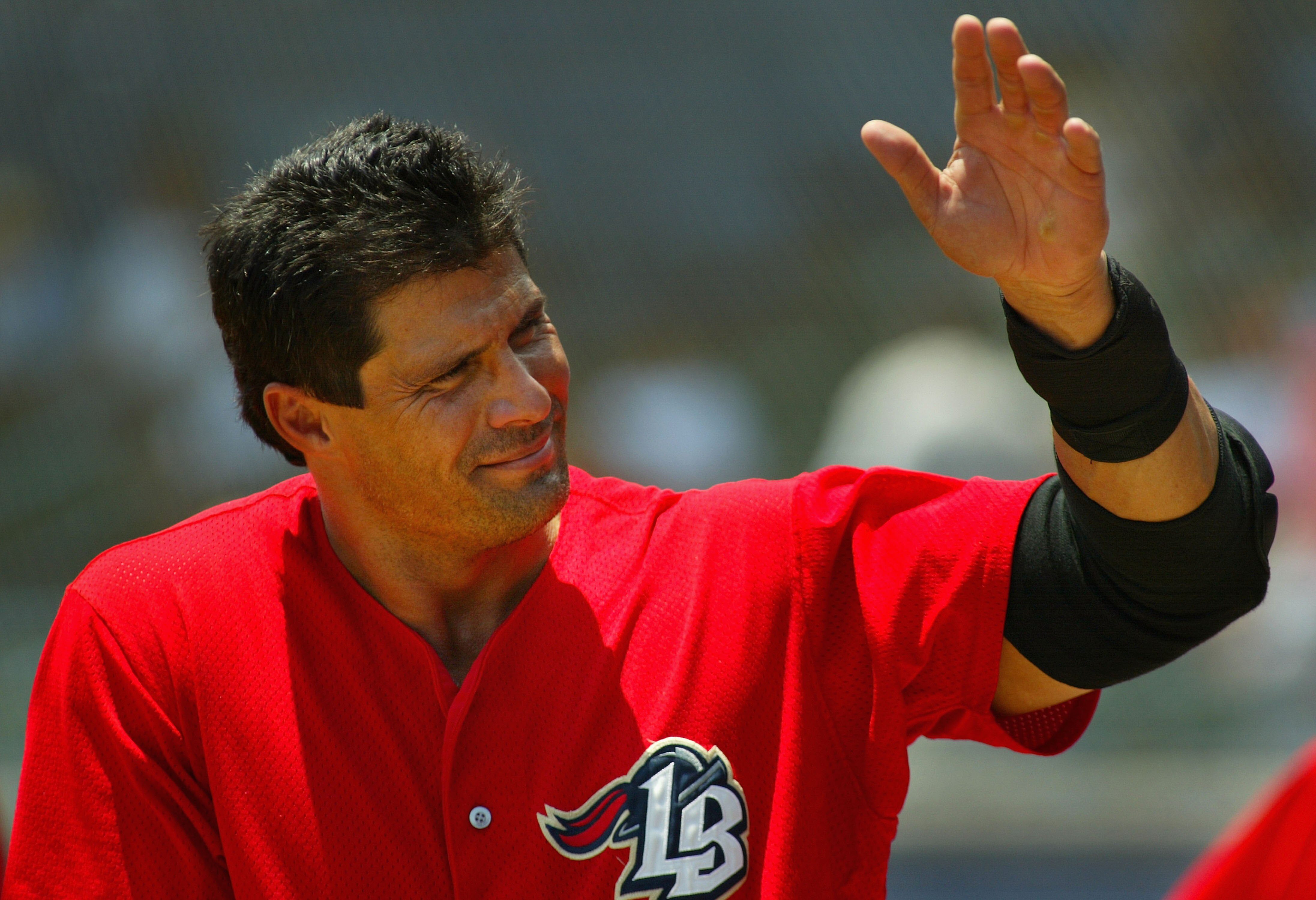 LONG BEACH, CA - JULY 16:  Jose Canseco #33 of the Long Beach Armada waves to the crowd during the Golden Baseball League game against the Fullerton Flyers on July 16, 2006 at Blair Field in Long Beach, California.  (Photo By Christian Petersen/Getty Imag