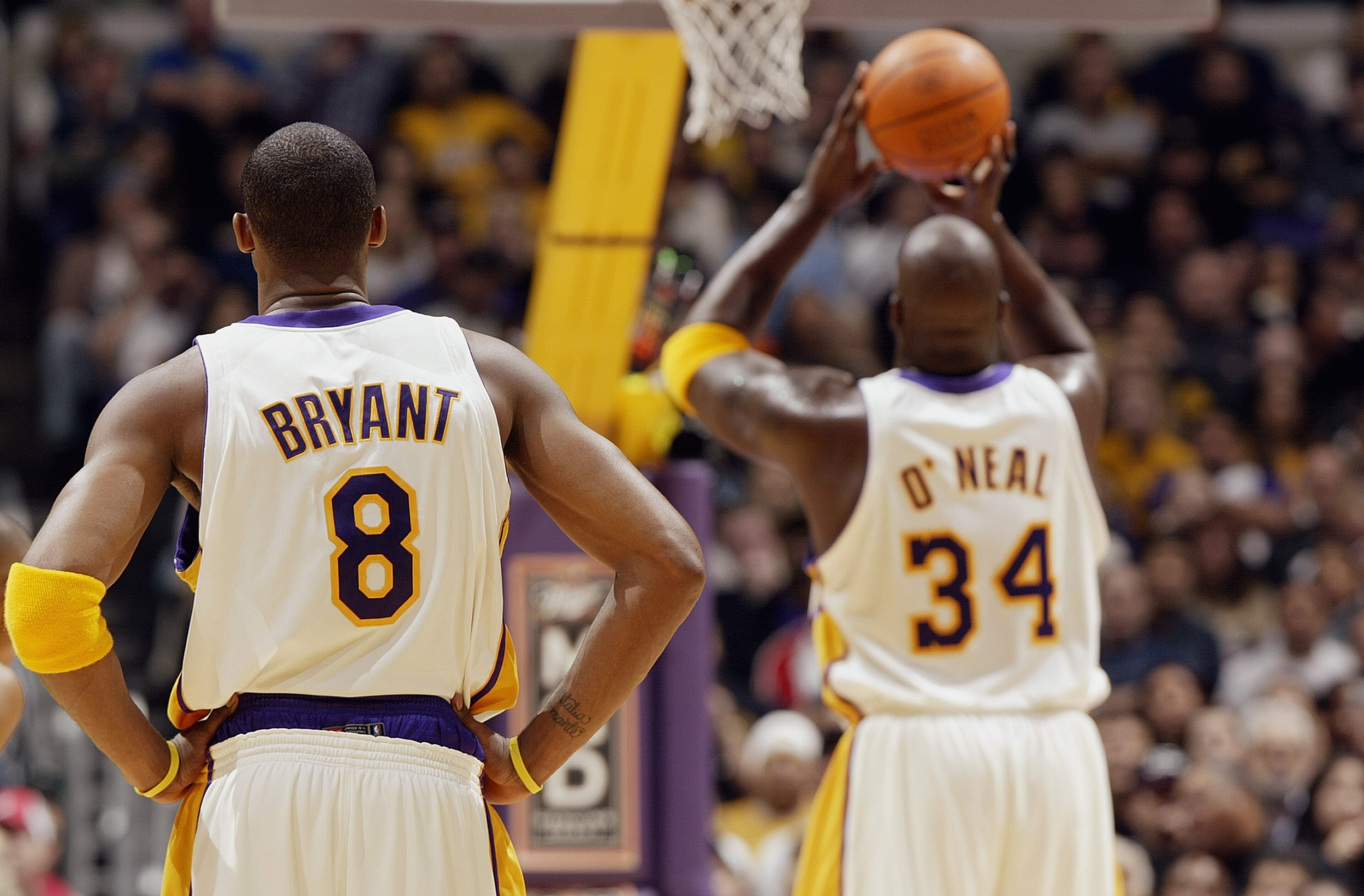 LOS ANGELES - NOVEMBER 30: Kobe Bryant #8 of the Los Angeles Lakers watches teammate Shaquille O'Neal #34 shoot a free throw during the game against the Indiana Pacers at Staples Center on November 30, 2003 in Los Angeles, California. The Lakers won 99- LOS ANGELES - NOVEMBER 30: Kobe Bryant #8 of the Los Angeles Lakers watches teammate Shaquille O'Neal #34 shoot a free throw during the game against the Indiana Pacers at Staples Center on November 30, 2003 in Los Angeles, California. The Lakers won 99-