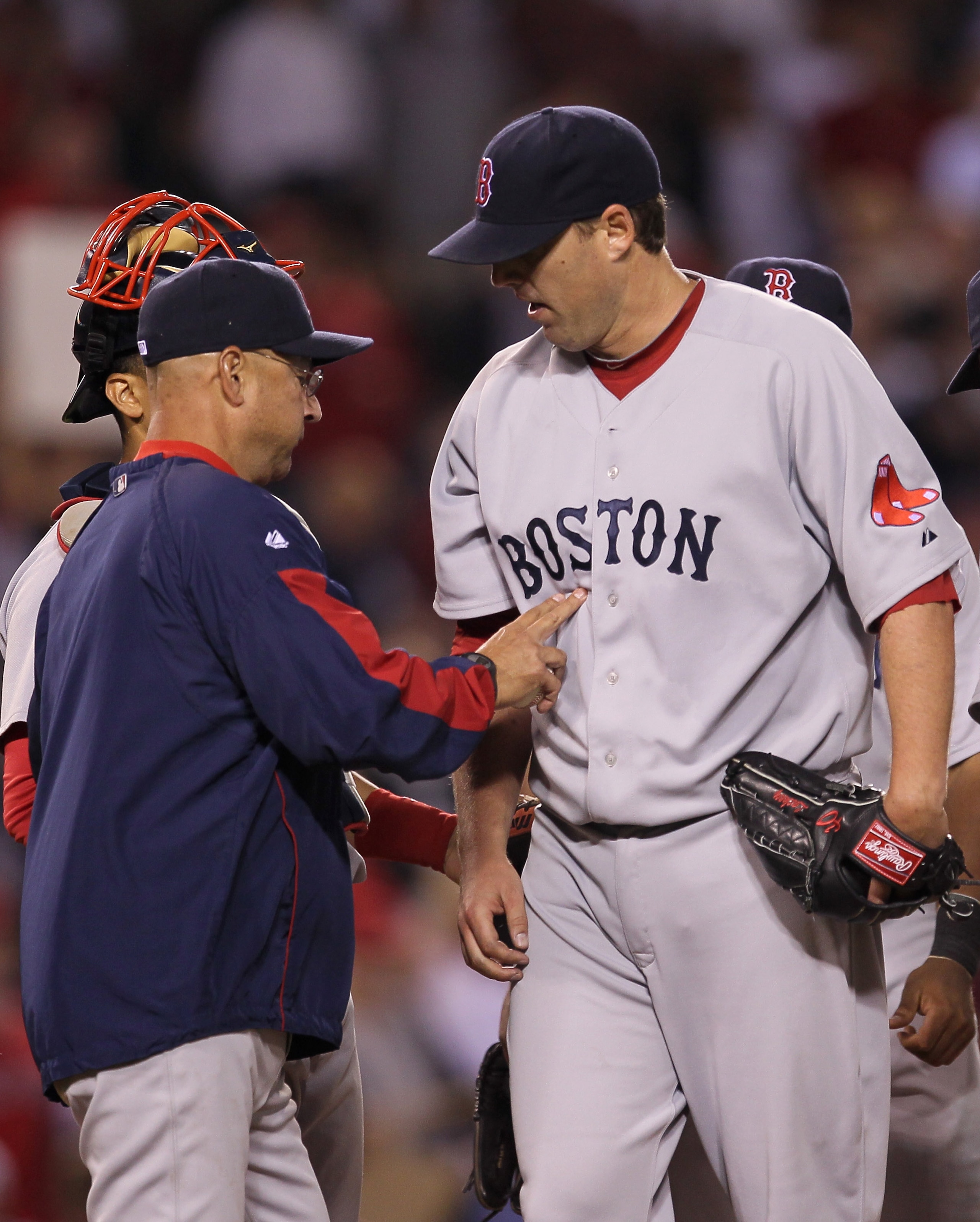 ANAHEIM, CA - JULY 27:  Manager Terry Francona of the Boston Red Sox relieves starting pitcher John Lackey #40 in the eighth inning of the game with the Los Angeles Angels of Anaheim on July 27, 2010 at Angel Stadium in Anaheim, California.  (Photo by Ste