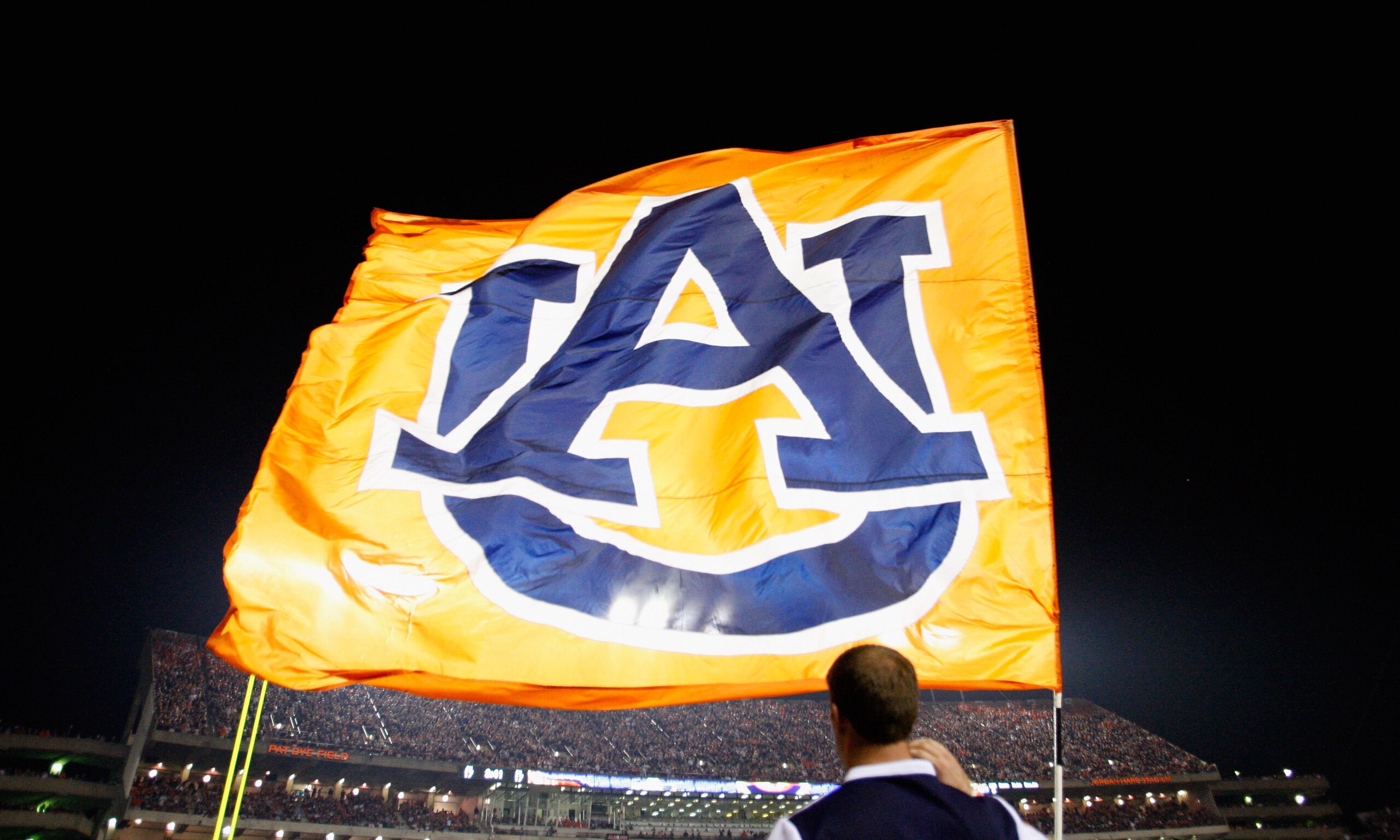 AUBURN, AL - SEPTEMBER 18:  Cheerleaders of the Auburn Tigers fly their flag during the game against the Clemson Tigers at Jordan-Hare Stadium on September 18, 2010 in Auburn, Alabama.  (Photo by Kevin C. Cox/Getty Images)