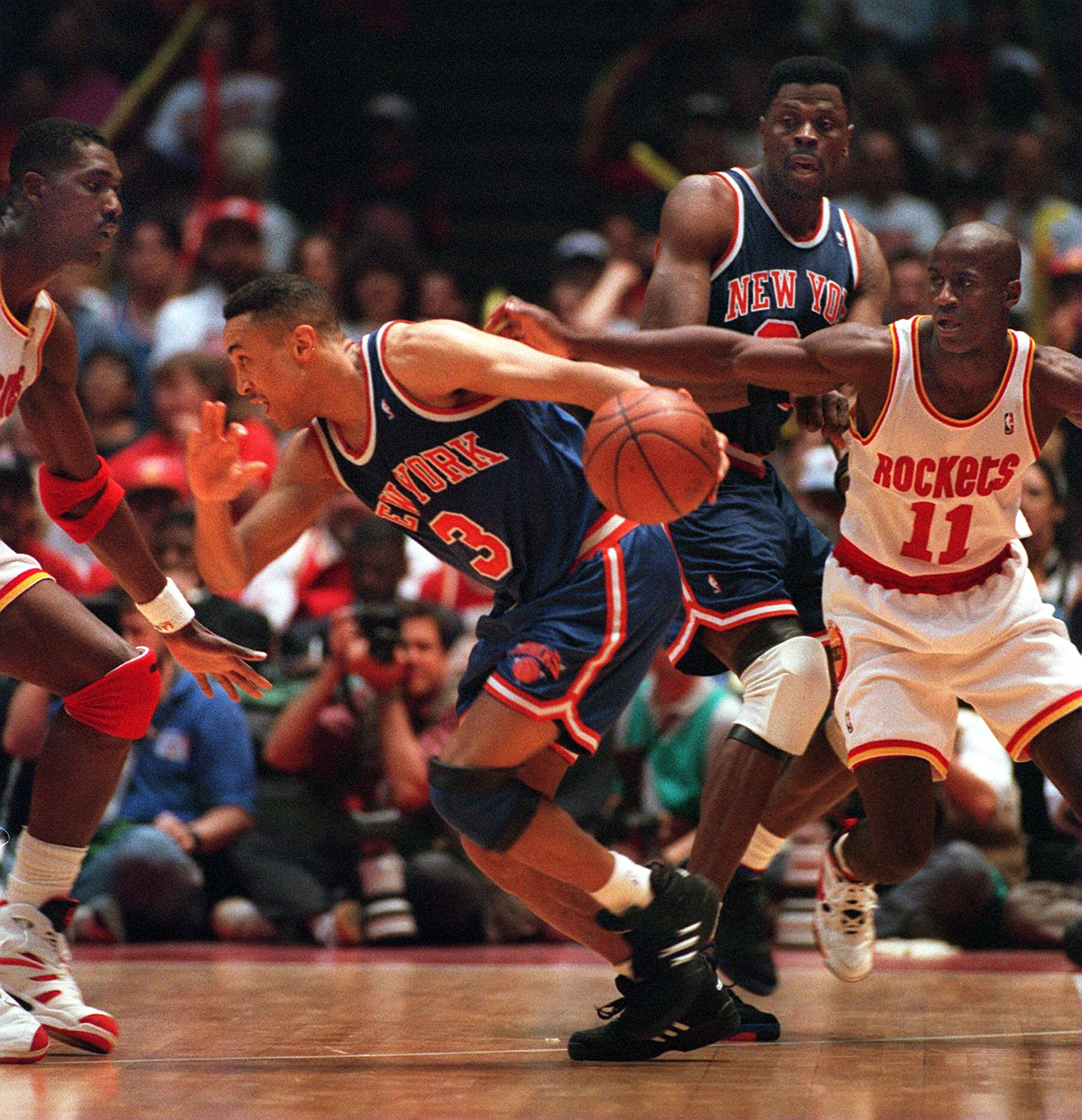 22 JUN 1994:  NEW YORK KNICK JOHN STARKS #3, DRIBBLES AROUND HOUSTON ROCKET HAKEEM OLAJUWON (LEFT) AS ROCKET VERNON MAXWELL PURSUES DURING THE SECOND QUARTER OF GAME 7 IN THE NBA CHAMPIONSHIP AT THE SUMMIT IN HOUSTON. Mandatory Credit: Allsport/ALLSPORT