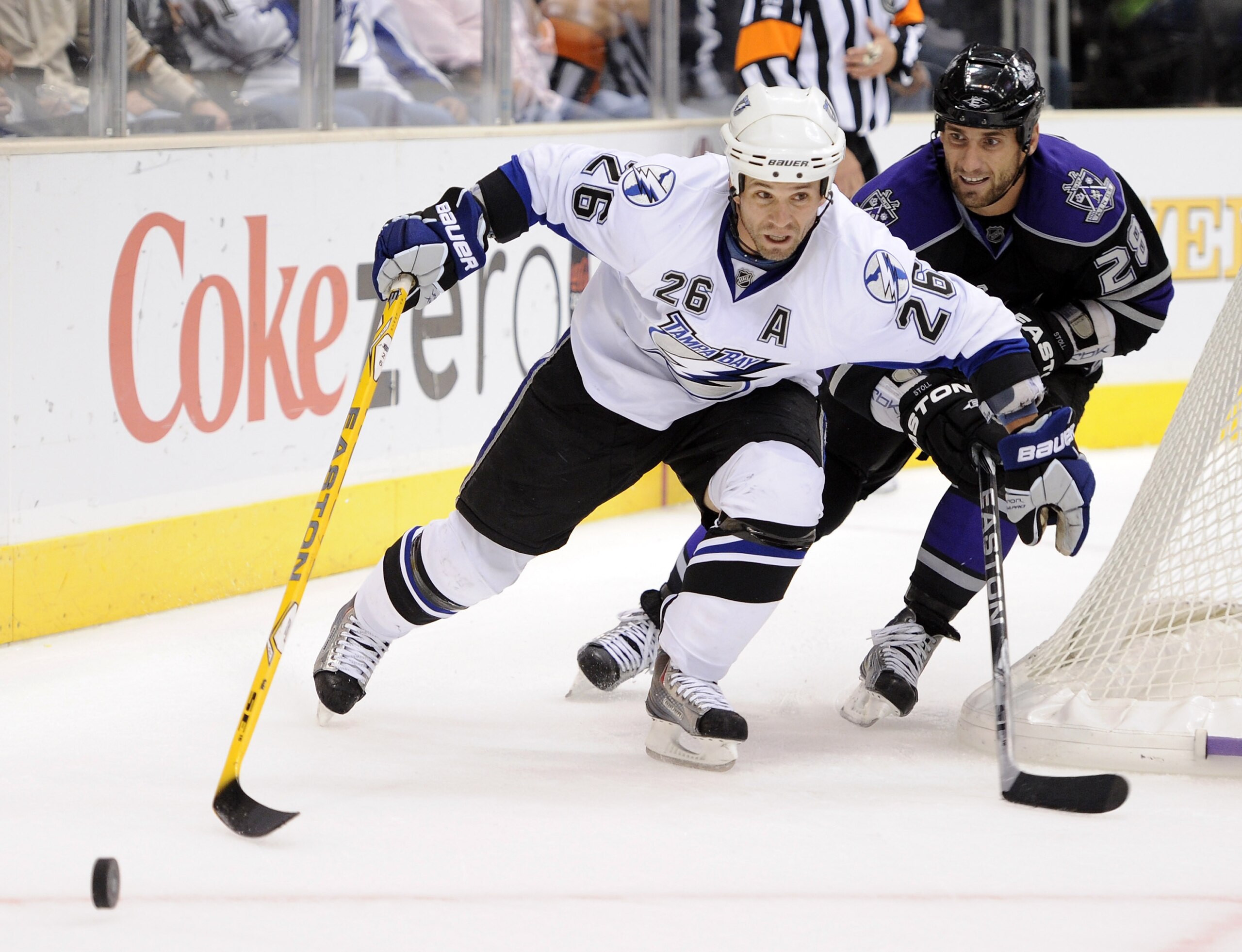 LOS ANGELES, CA - NOVEMBER 04: Martin St. Louis #26 of the Tampa Bay Lightning fends off Jarret Stoll #28 of the Los Angeles Kings during the third period at Staples Center on November 4, 2010 in Los Angeles, California. (Photo by Harry How/Getty Images LOS ANGELES, CA - NOVEMBER 04: Martin St. Louis #26 of the Tampa Bay Lightning fends off Jarret Stoll #28 of the Los Angeles Kings during the third period at Staples Center on November 4, 2010 in Los Angeles, California. (Photo by Harry How/Getty Images