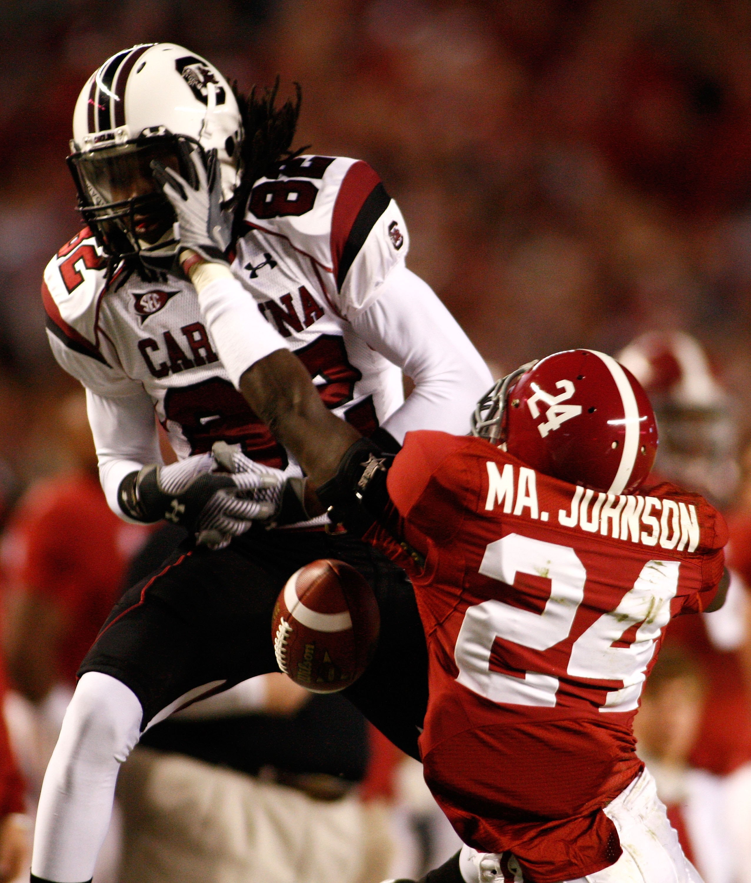 TUSCALOOSA - OCTOBER 17:  Defensive back Marquis Johnson #24 of the Alabama Crimson Tide breaks up a pass intended for wide receiver D.L. Moore #82 of the South Carolina Gamecocks during the game at Bryant-Denny Stadium in Tuscaloosa, Alabama on October 1