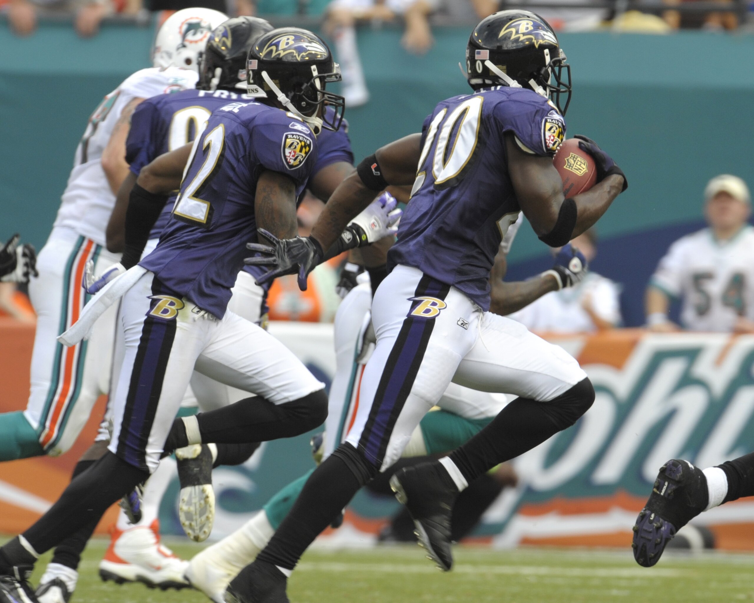 MIAMI, FL - JANUARY 4:  Safety Ed Reed #20 of the Baltimore Ravens returns an interception against the Miami Dolphins in an NFL Wildcard Playoff Game at Dolphins Stadium on January 4, 2009 in Miami, Florida.  (Photo by Al Messerschmidt/Getty Images)
