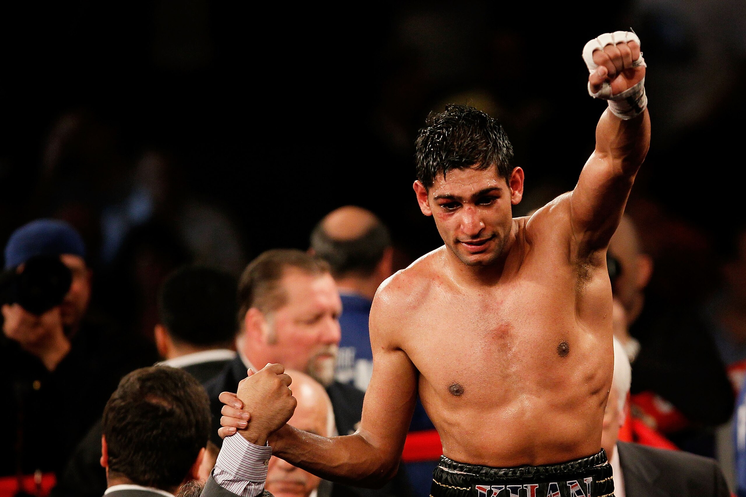 NEW YORK - MAY 15:  Amir Khan of Great Britain celebrates after defeating Paulie Malignaggi by TKO in the 11th round of his WBA light welterweight title fight at Madison Square Garden on May 15, 2010 in New York City.  (Photo by Chris Trotman/Getty Images