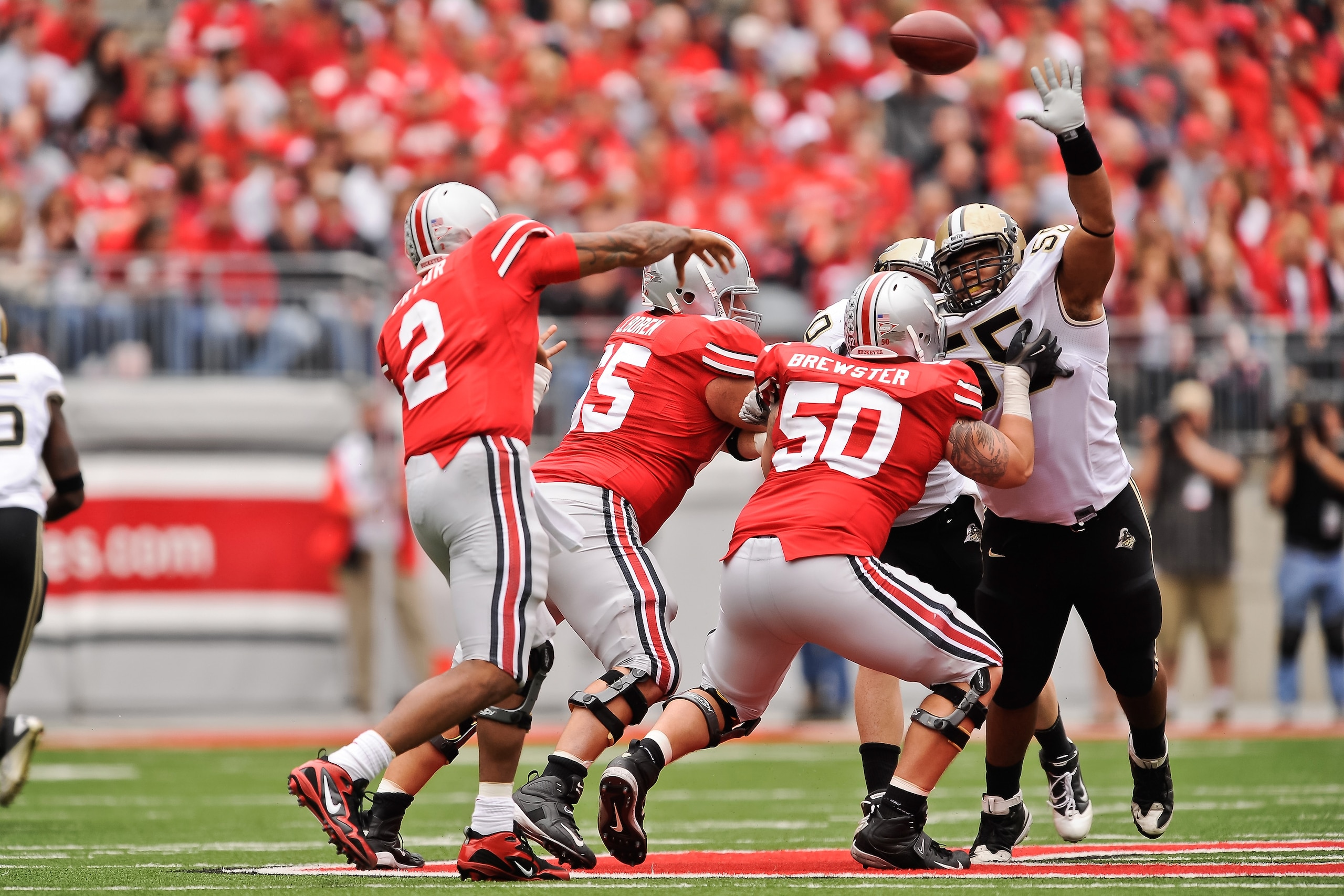 COLUMBUS, OH - OCTOBER 23:  Brandon Taylor #55 of the Purdue Boilermakers attempts to block a pass attempt by Terrelle Pryor #2 of the Ohio State Buckeyes at Ohio Stadium on October 23, 2010 in Columbus, Ohio.  (Photo by Jamie Sabau/Getty Images)