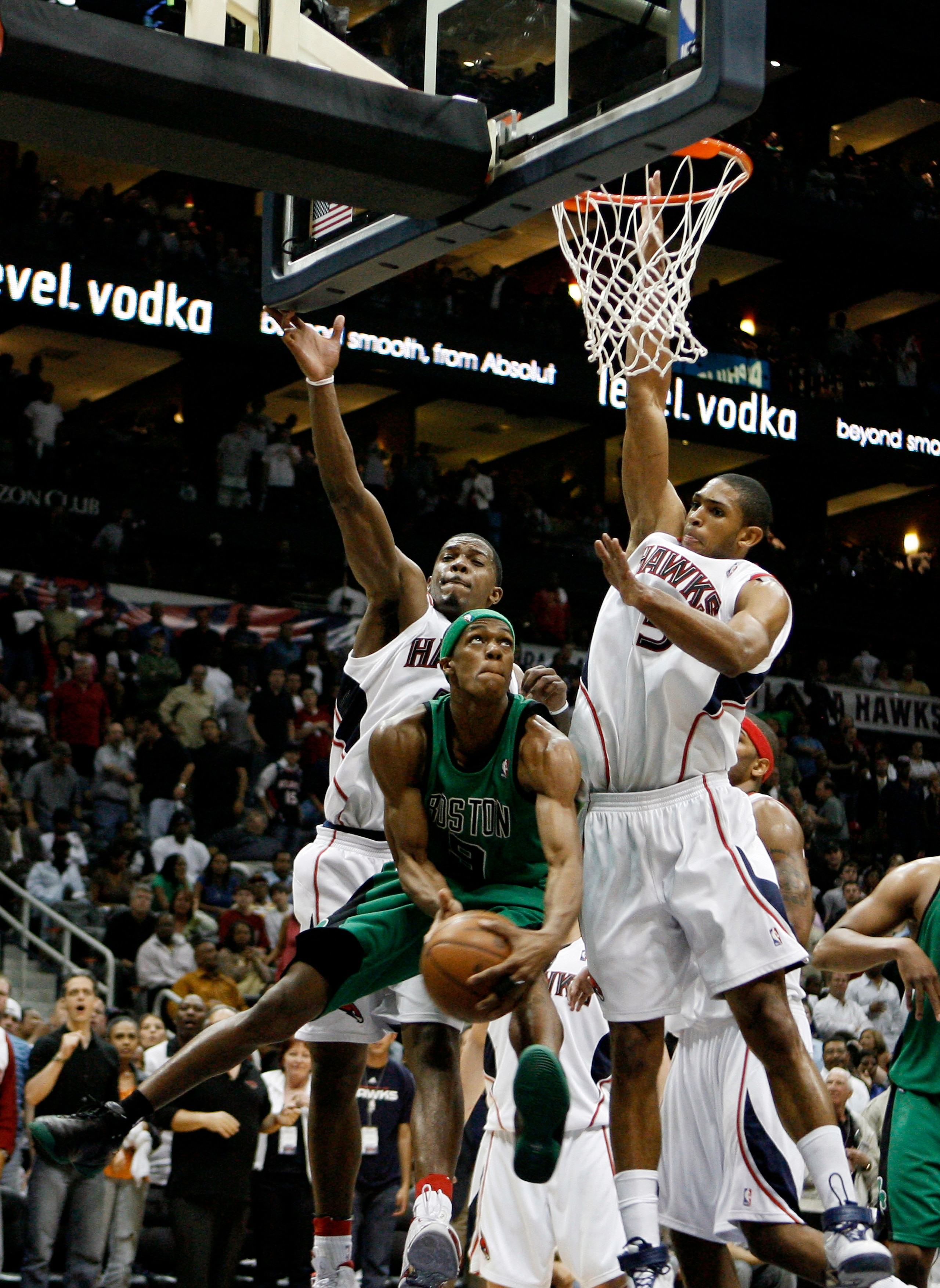 ATLANTA - APRIL 26: Guard Rajon Rondo #9 of the Boston Celtics tries to score around defenders Al Horford #15 and Joe Johnson #2 of the Atlanta Hawks during Game Three of the Eastern Conference Quarterfinals against the Atlanta Hawks during the 2008 NBA ATLANTA - APRIL 26: Guard Rajon Rondo #9 of the Boston Celtics tries to score around defenders Al Horford #15 and Joe Johnson #2 of the Atlanta Hawks during Game Three of the Eastern Conference Quarterfinals against the Atlanta Hawks during the 2008 NBA
