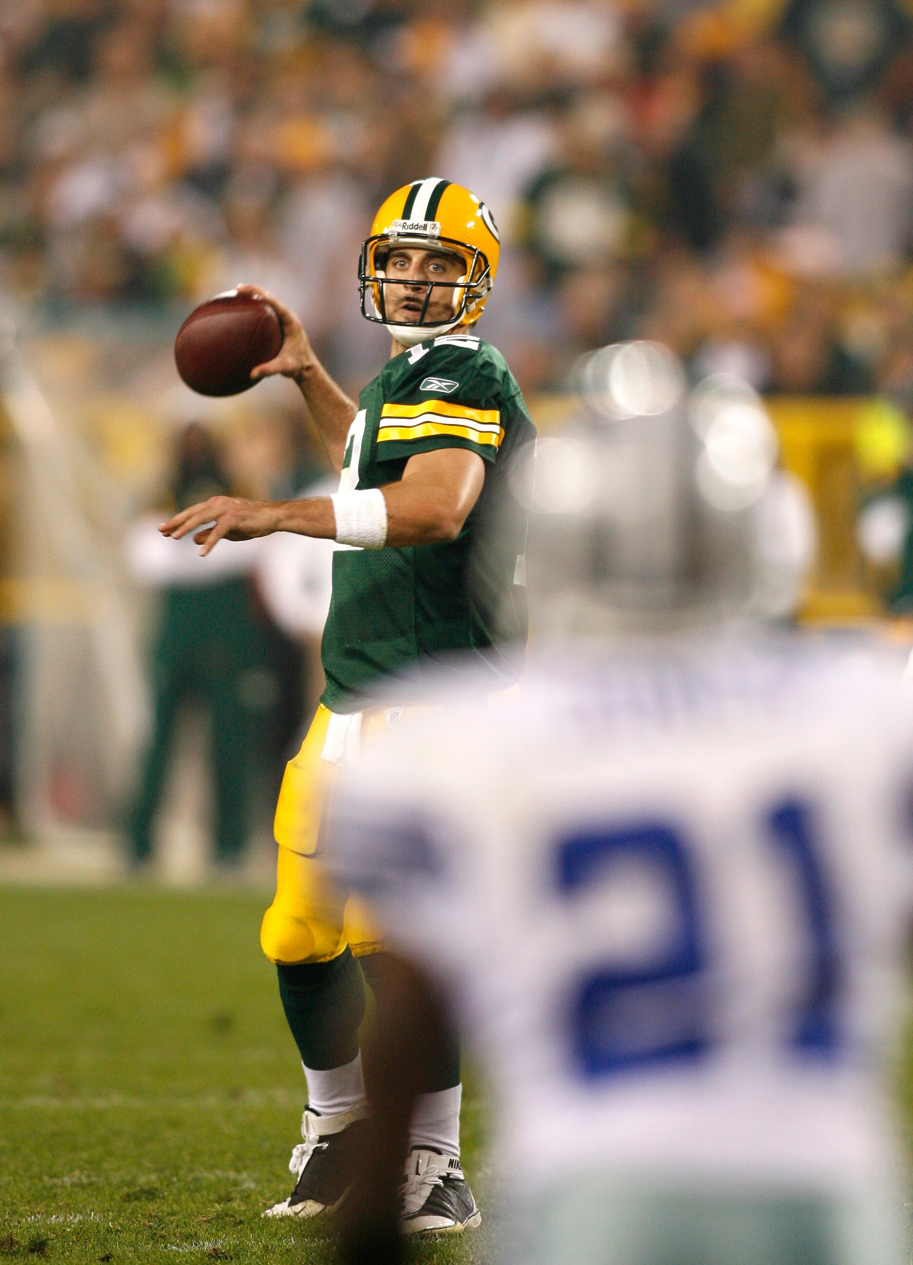 GREEN BAY - SEPTEMBER 21:  Aaron Rodgers #12 of the Green Bay Packers  passes the ball against the Dallas Cowboys at Lambeau Field on September 21, 2008 in Green Bay, Wisconsin. The Cowboys defeated the Packers in 27- 16.  (Photo by Tom Hauck/Getty Images