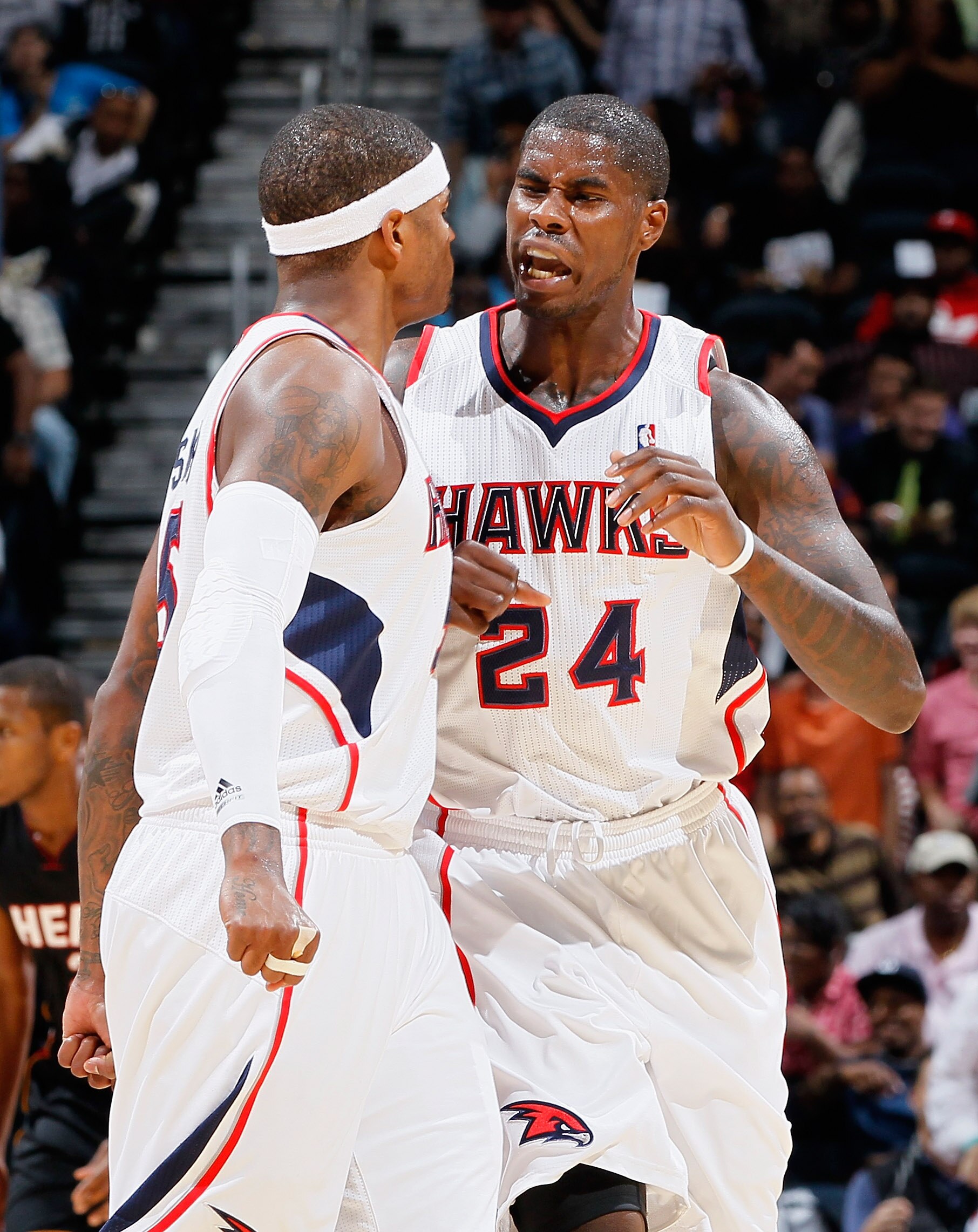 ATLANTA - OCTOBER 21:  Marvin Williams #24 of the Atlanta Hawks reacts with Josh Smith #5 after Williams' dunk against the Miami Heat at Philips Arena on October 21, 2010 in Atlanta, Georgia.  (Photo by Kevin C. Cox/Getty Images)