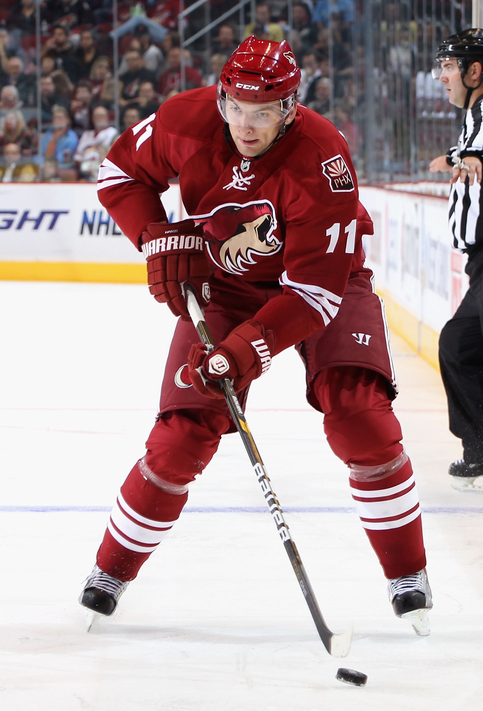 GLENDALE, AZ - NOVEMBER 03:  Martin Hanzal #11 of the Phoenix Coyotes skates with the puck during the NHL game against the Nashville Predators at Jobing.com Arena on November 3, 2010 in Glendale, Arizona. The Coyotes defeated the Predators 4-3.  (Photo by