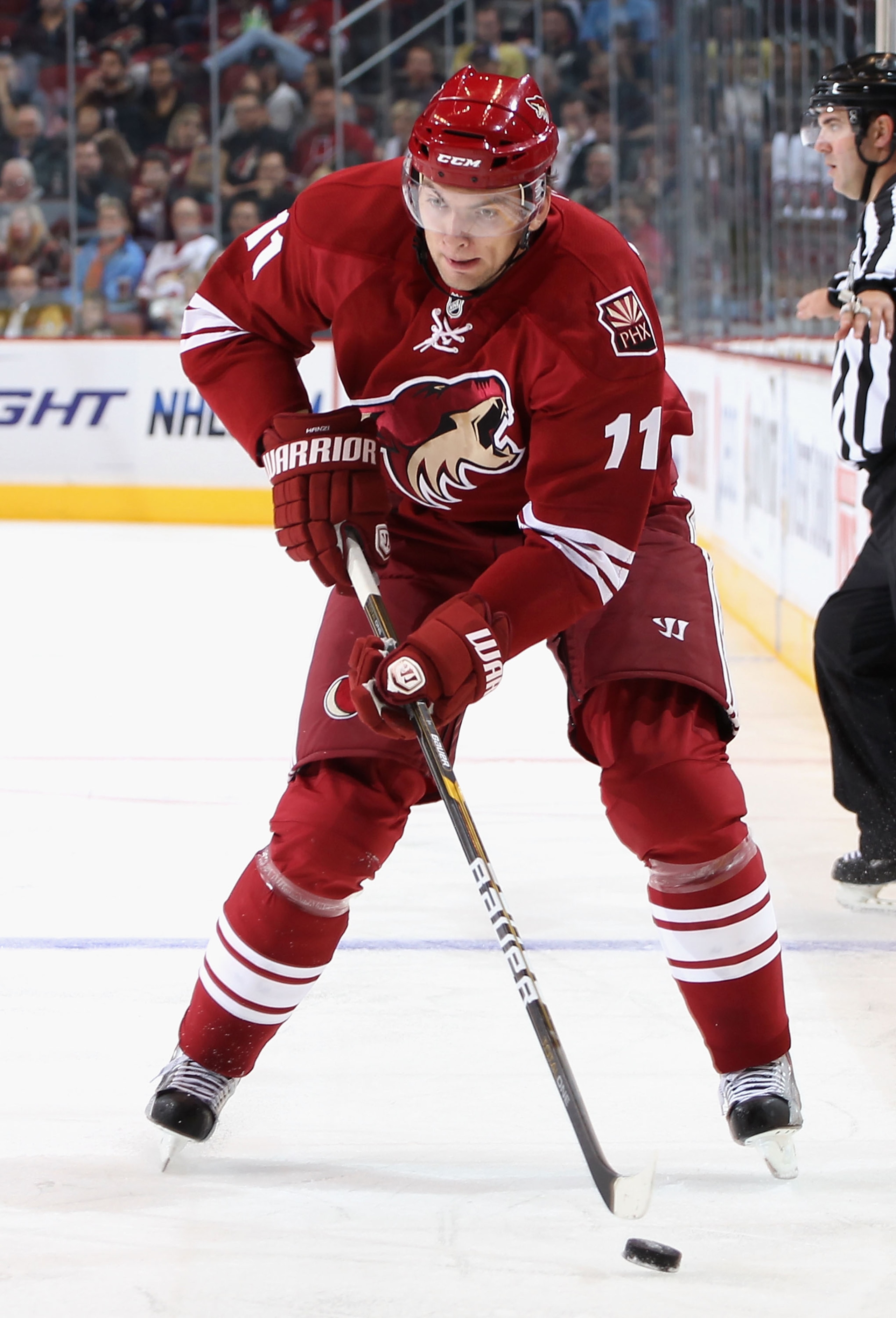 GLENDALE, AZ - NOVEMBER 03:  Martin Hanzal #11 of the Phoenix Coyotes skates with the puck during the NHL game against the Nashville Predators at Jobing.com Arena on November 3, 2010 in Glendale, Arizona. The Coyotes defeated the Predators 4-3.  (Photo by