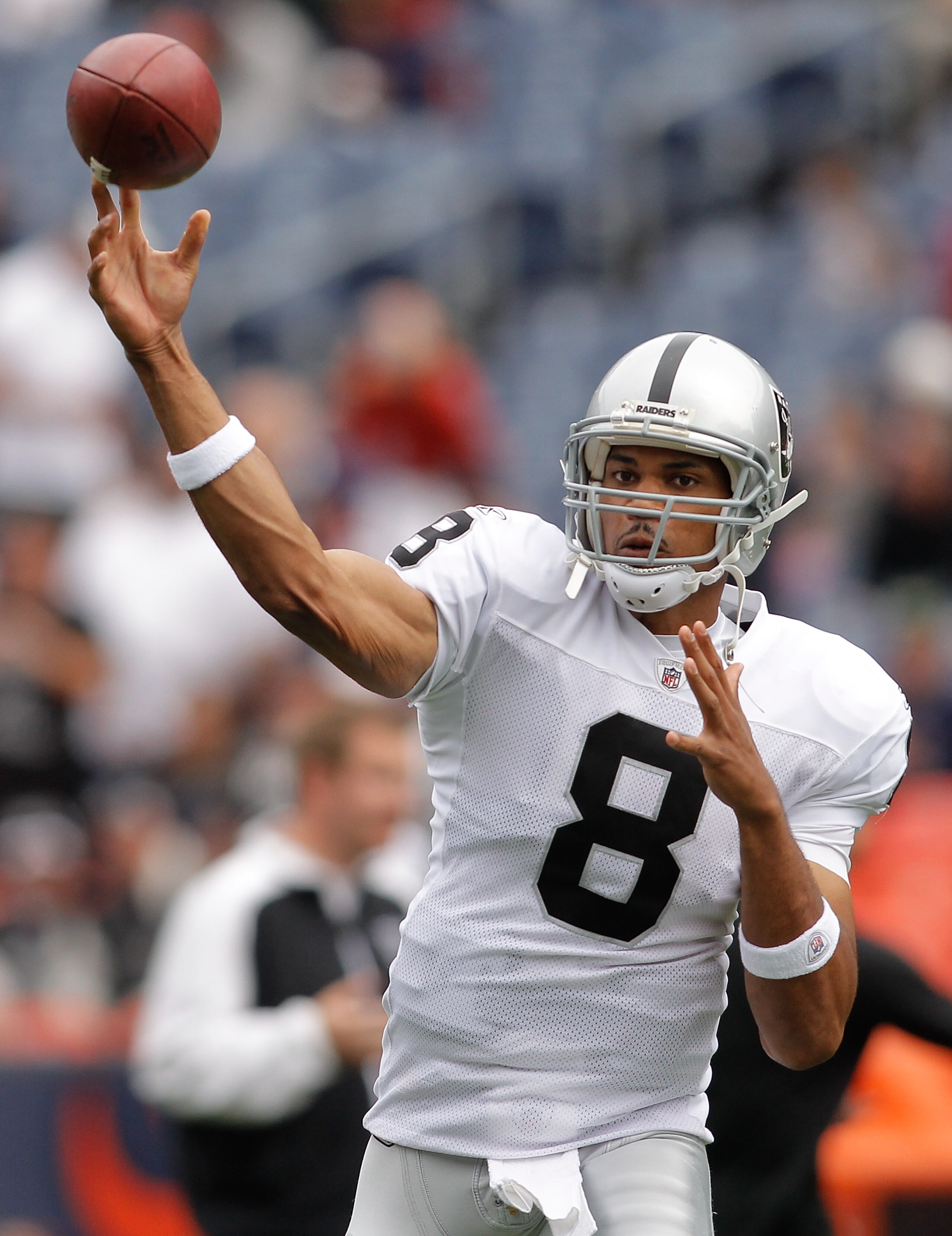 DENVER - OCTOBER 24:  Quarterback Jason Campbell #8 of the Oakland Raiders warms up before taking on the Denver Broncos at INVESCO Field at Mile High on October 24, 2010 in Denver, Colorado. (Photo by Justin Edmonds/Getty Images)