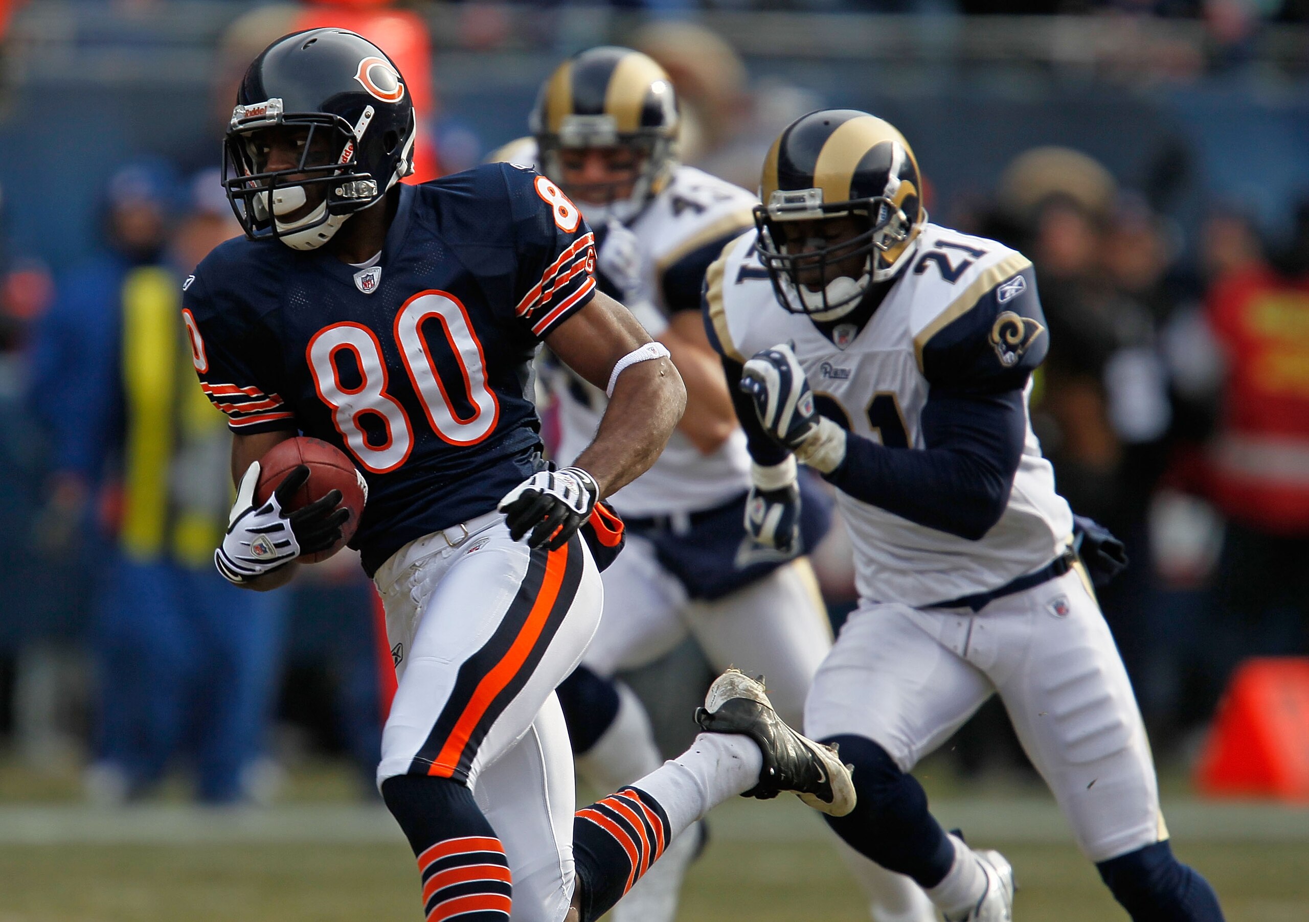 CHICAGO - DECEMBER 06:  Earl Bennett #80 of the Chicago Bears breaks for a long run and is chased by (L-R) Craig Dahl #43 and Oshiomogho Atogwe of the St. Louis Rams at Soldier Field on December 6, 2009 in Chicago, Illinois. The Bears defeated the Rams 17