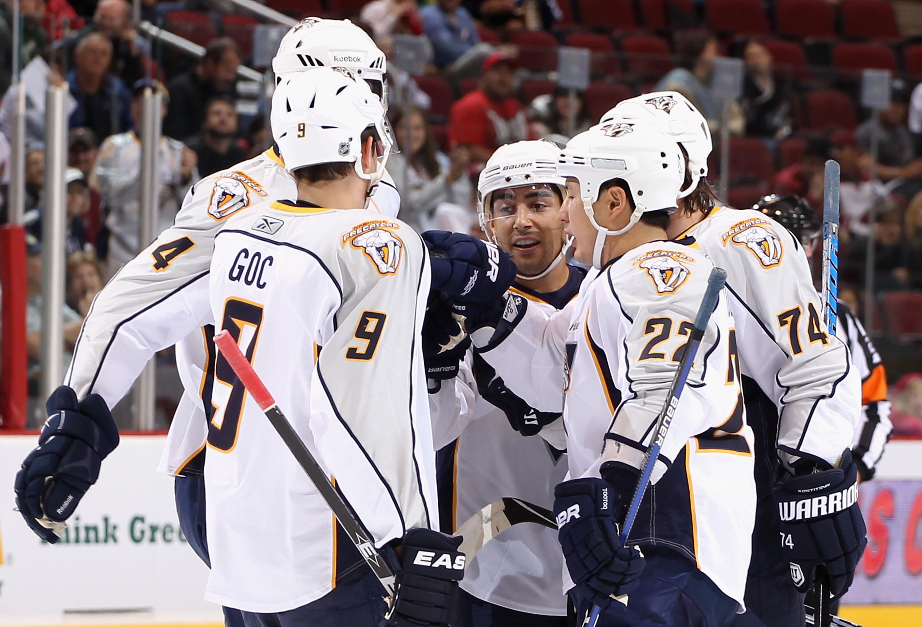 GLENDALE, AZ - NOVEMBER 03:  Francis Bouillon #51 (C) of the Nashville Predators celebrates with teammates after scoring a first period goal against the Phoenix Coyotes during the NHL game at Jobing.com Arena on November 3, 2010 in Glendale, Arizona.  (Ph