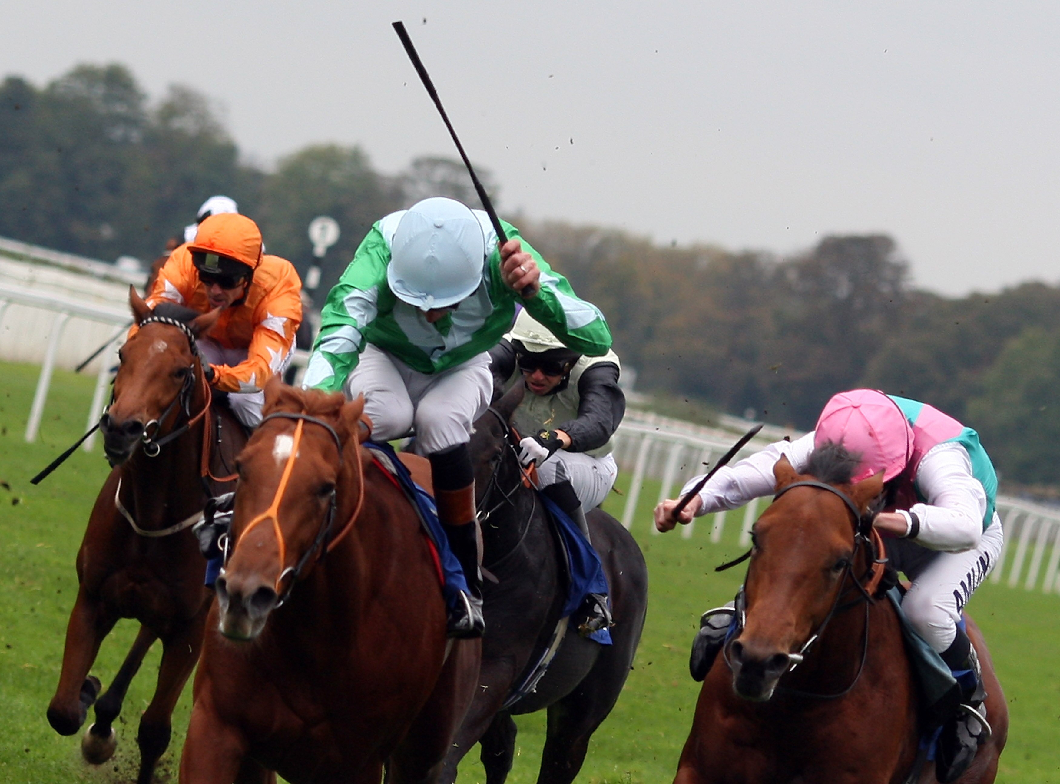WINDSOR, UNITED KINGDOM - OCTOBER 13:  Richard Hughes (whip raised) and Bold Tie get the better of Standpoint ridden by jockey Ryan Moore (R) to land the E.B.f. Maiden Stakes Race run at Windsor Racecourse on October 13, 2008, in Windsor, England.  (Photo