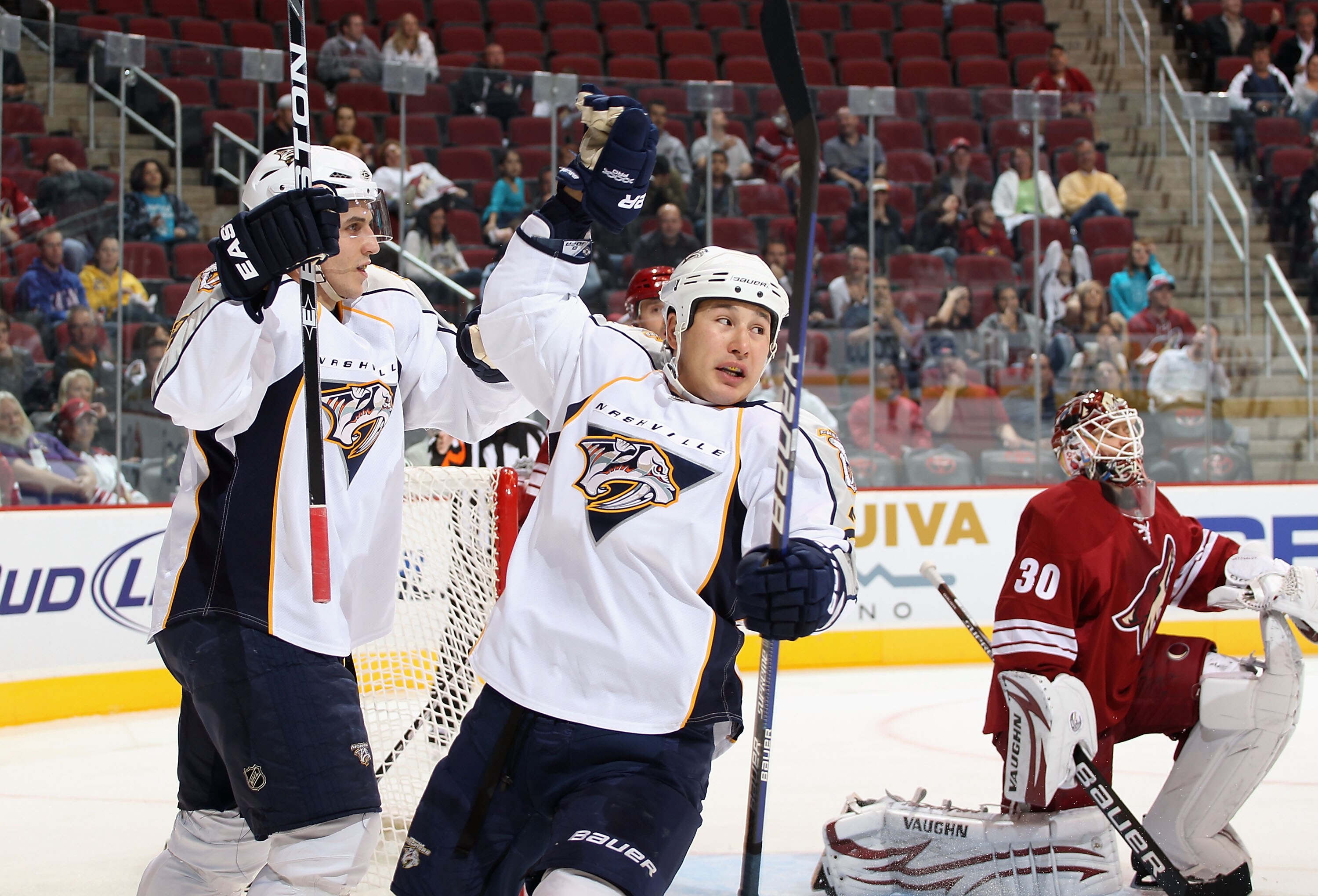 GLENDALE, AZ - NOVEMBER 03:  Marcel Goc #9 and Jordin Tootoo #22 of the Nashville Predators celebrate after assisting on a first period goal scored by Francis Bouillon (not pictured) against goaltender Ilya Bryzgalov #30 of the Phoenix Coyotes during the