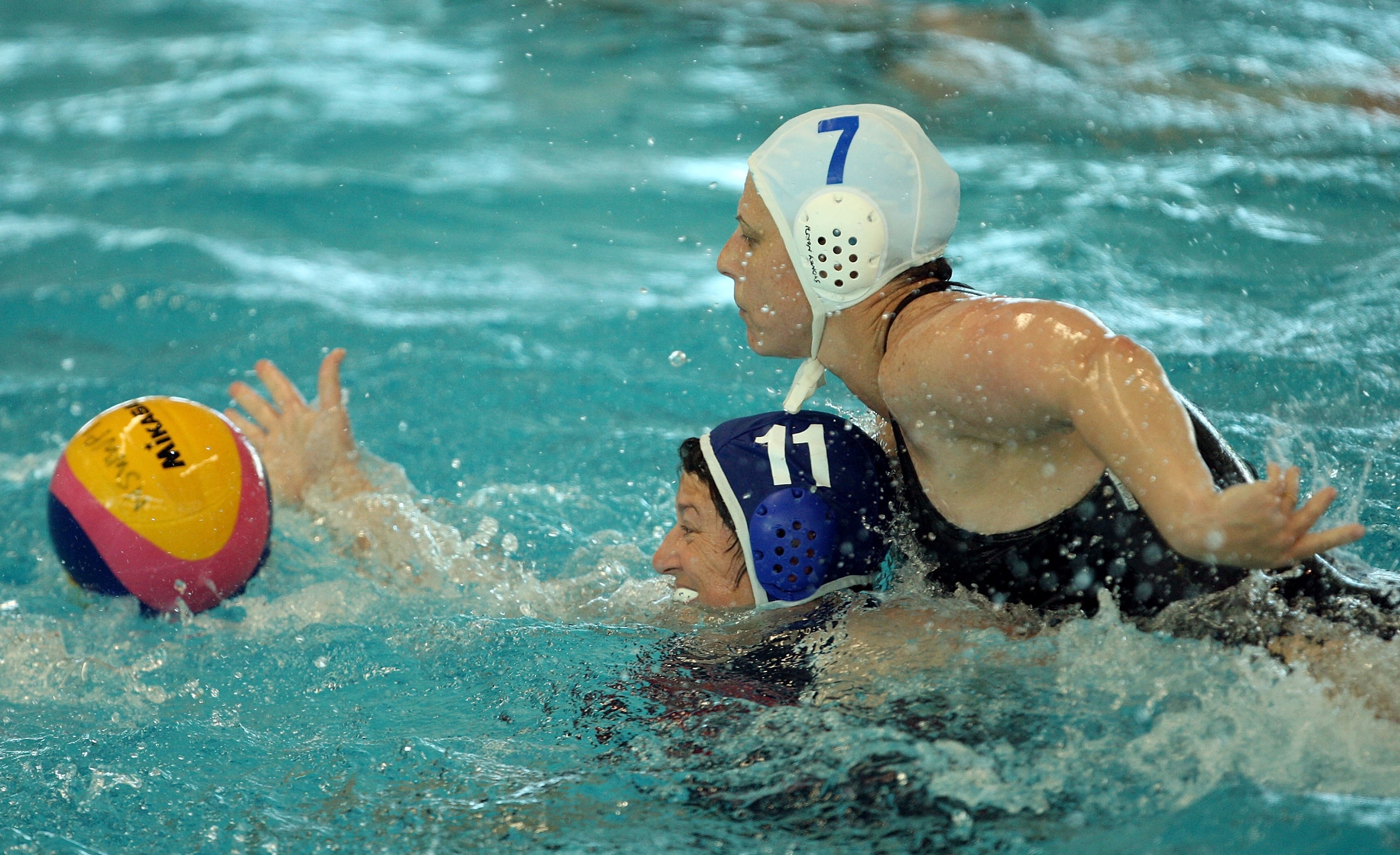 SYDNEY, AUSTRALIA - OCTOBER 17: Dani Woodhouse of Way Beyond 2000 is put under pressure from Jill Doyle of Northern Beaches during the women's 35+ water polo final on day eight of the 2009 Sydney World Masters Games at Ryde Aquatic Leisure Centre on Octob SYDNEY, AUSTRALIA - OCTOBER 17: Dani Woodhouse of Way Beyond 2000 is put under pressure from Jill Doyle of Northern Beaches during the women's 35+ water polo final on day eight of the 2009 Sydney World Masters Games at Ryde Aquatic Leisure Centre on Octob