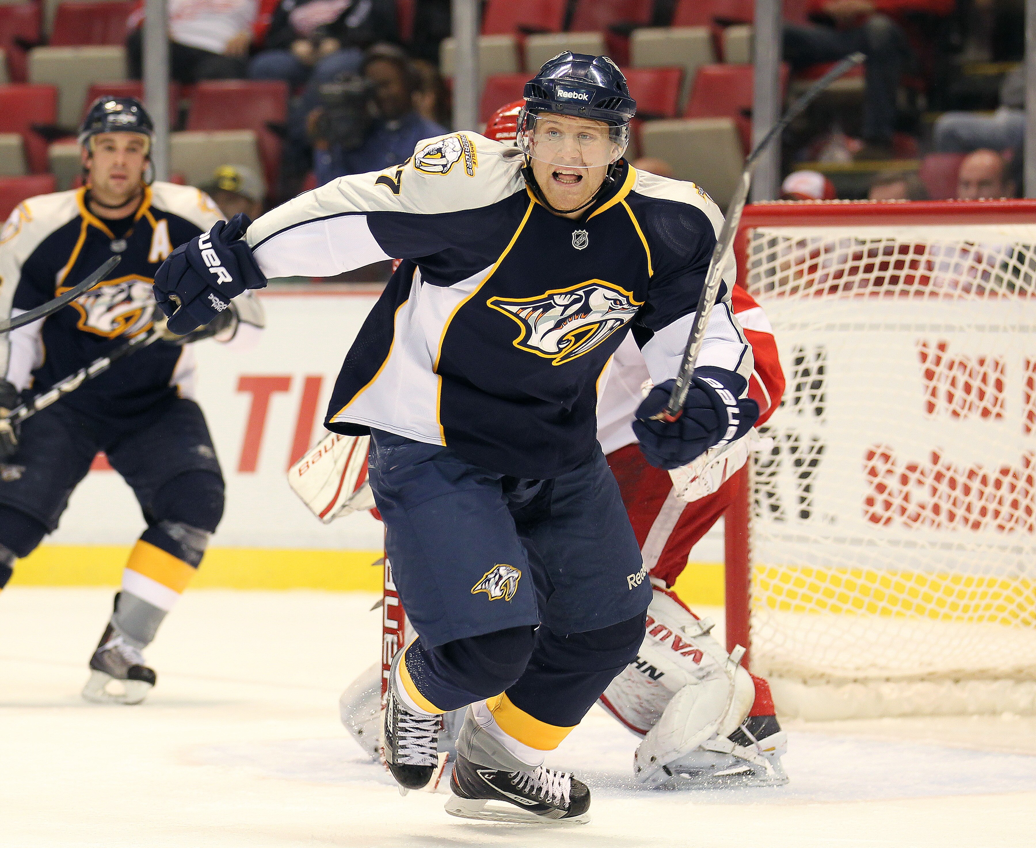 DETROIT - OCTOBER 30:  Patric Hornqvist #27 of the Nashville Predators chases after a loose puck in a game against the Detroit Red Wings on October 30, 2010 at the Joe Louis Arena in Detroit , Michigan. The Wings defeated the Predators 5-2. (Photo by Clau