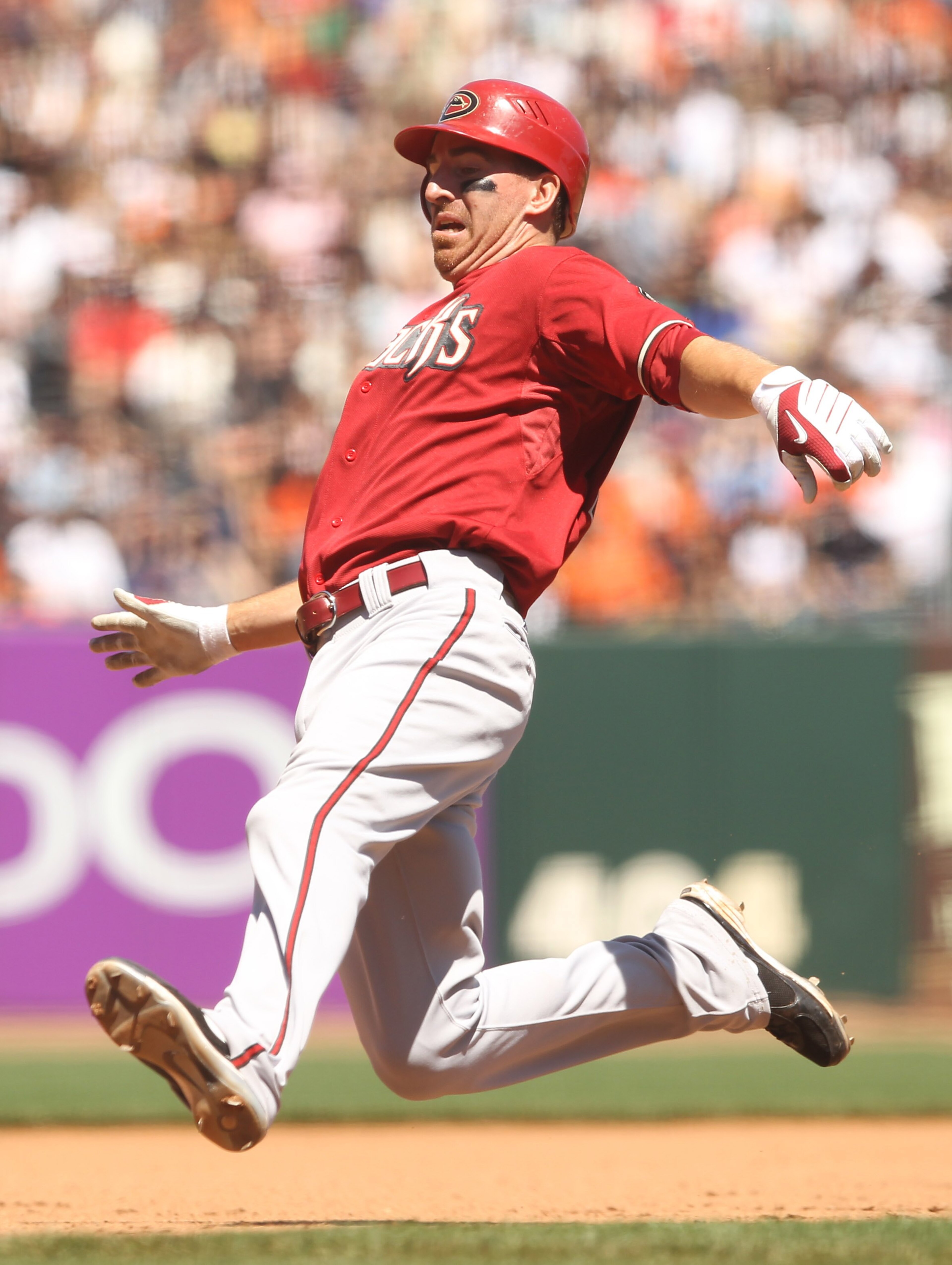 SAN FRANCISCO - MAY 30:  Adam LaRoche of#25 the Arizona Diamondbacks slides in to third base during their game against the San Francisco Giants at AT&T Park on May 30, 2010 in San Francisco, California.  (Photo by Ezra Shaw/Getty Images)