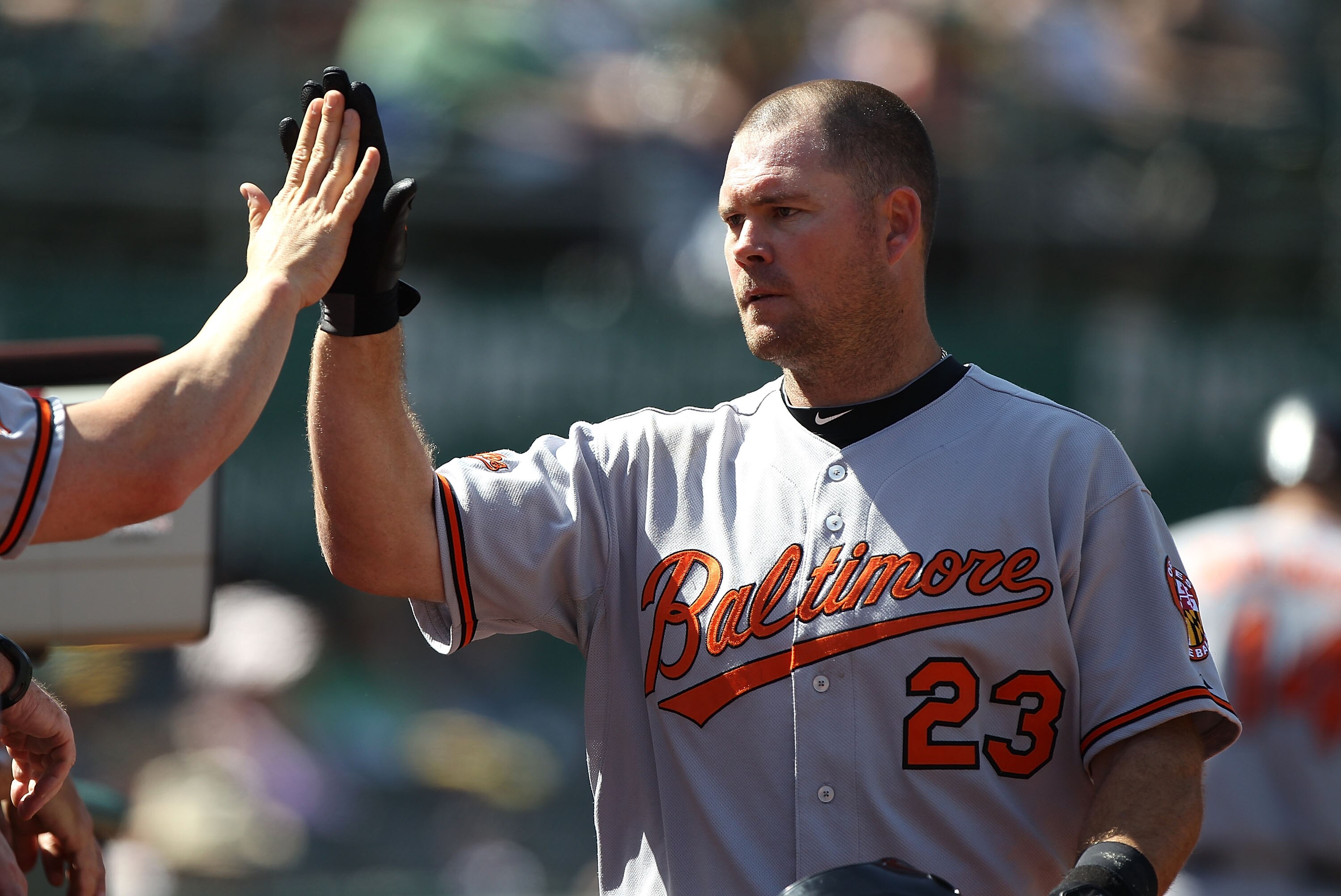 OAKLAND, CA - APRIL 18:  Ty Wigginton #23 of the Baltimore Orioles celebrates after hitting a two run home run in the ninth inning against the Oakland Athletics during an MLB game at the Oakland-Alameda County Coliseum on April 18, 2010 in Oakland, Califo