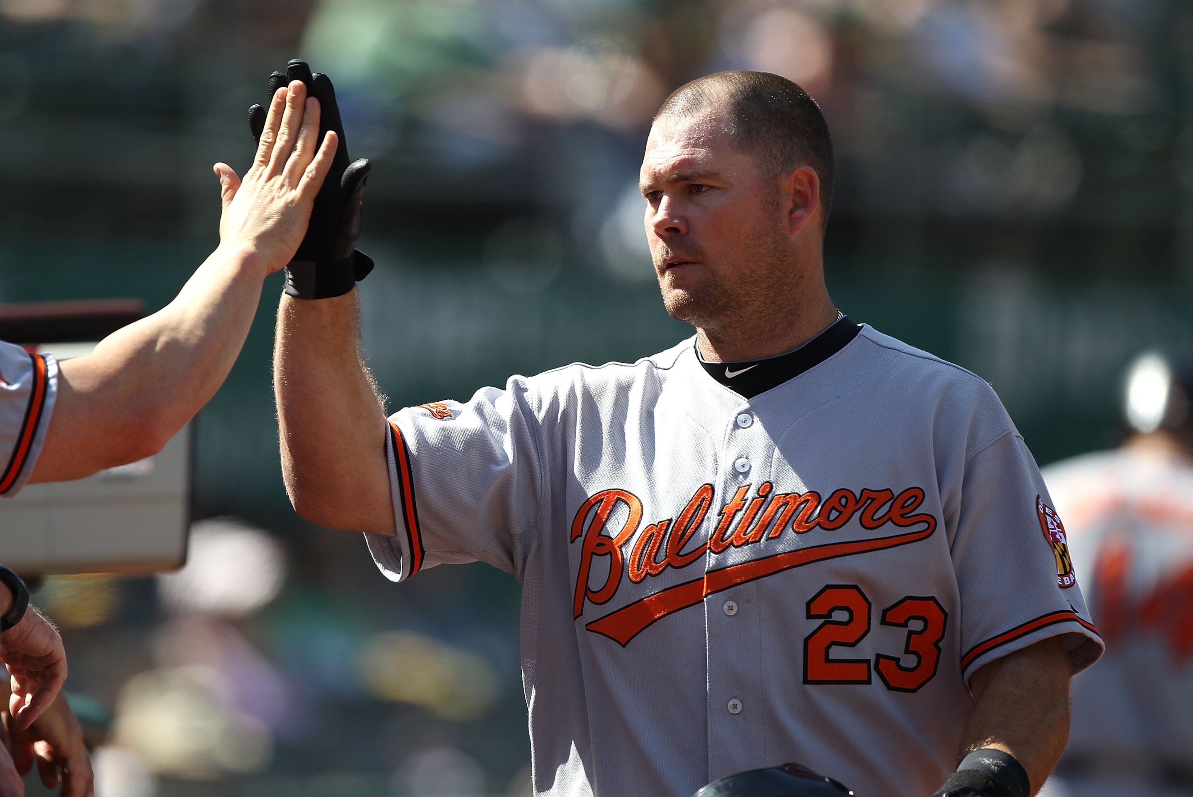 OAKLAND, CA - APRIL 18:  Ty Wigginton #23 of the Baltimore Orioles celebrates after hitting a two run home run in the ninth inning against the Oakland Athletics during an MLB game at the Oakland-Alameda County Coliseum on April 18, 2010 in Oakland, Califo