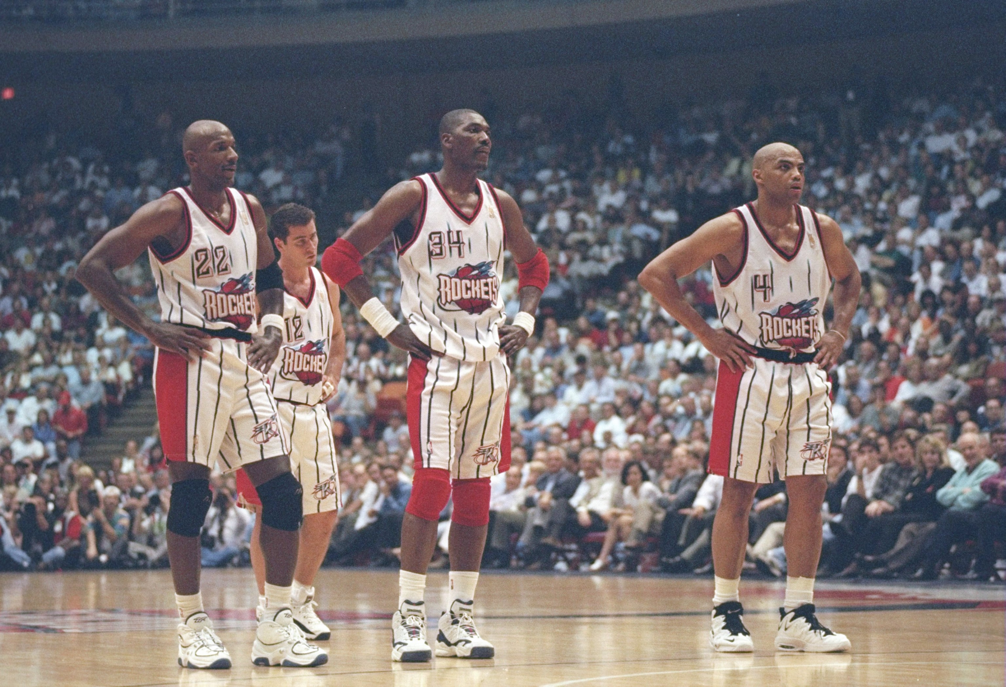 7 May 1997: Center Hakeem Olajuwon, forward Clyde Drexler (left) and forward Charles Barkley of the Houston Rockets stands on the court during a playoff game against the Seattle Supersonics at the Summit in Houston, Texas. The Supersonics won the game 1 7 May 1997: Center Hakeem Olajuwon, forward Clyde Drexler (left) and forward Charles Barkley of the Houston Rockets stands on the court during a playoff game against the Seattle Supersonics at the Summit in Houston, Texas. The Supersonics won the game 1