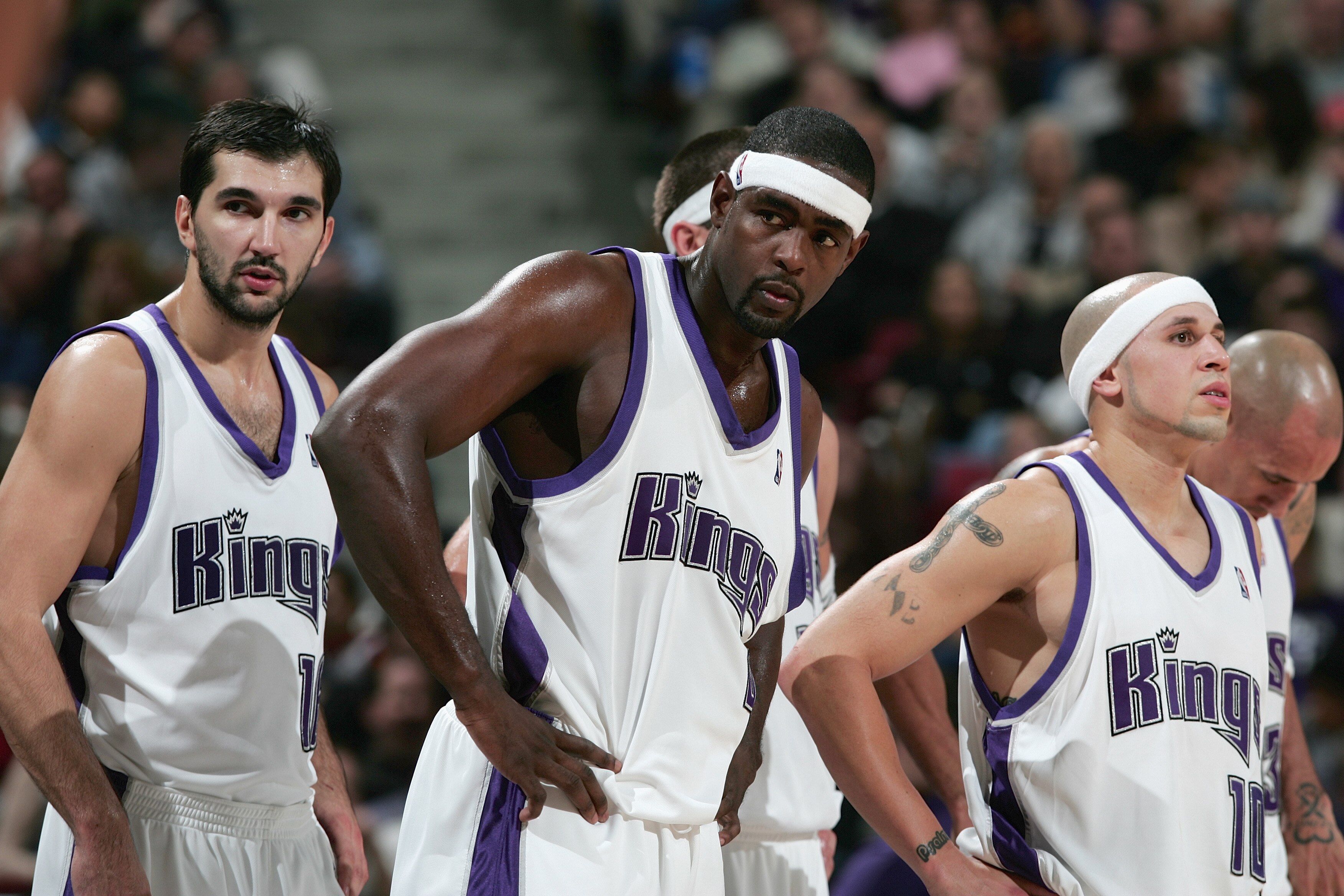 SACRAMENTO, CA - NOVEMBER 19:  Peja Stojakovic #16 of the Sacramento Kings stands next to his teammates Chris Webber #4 and Mike Bibby #10 during the game against the Memphis Gizzlies at Arco Arena on November 19, 2004 in Sacramento, California.  The King