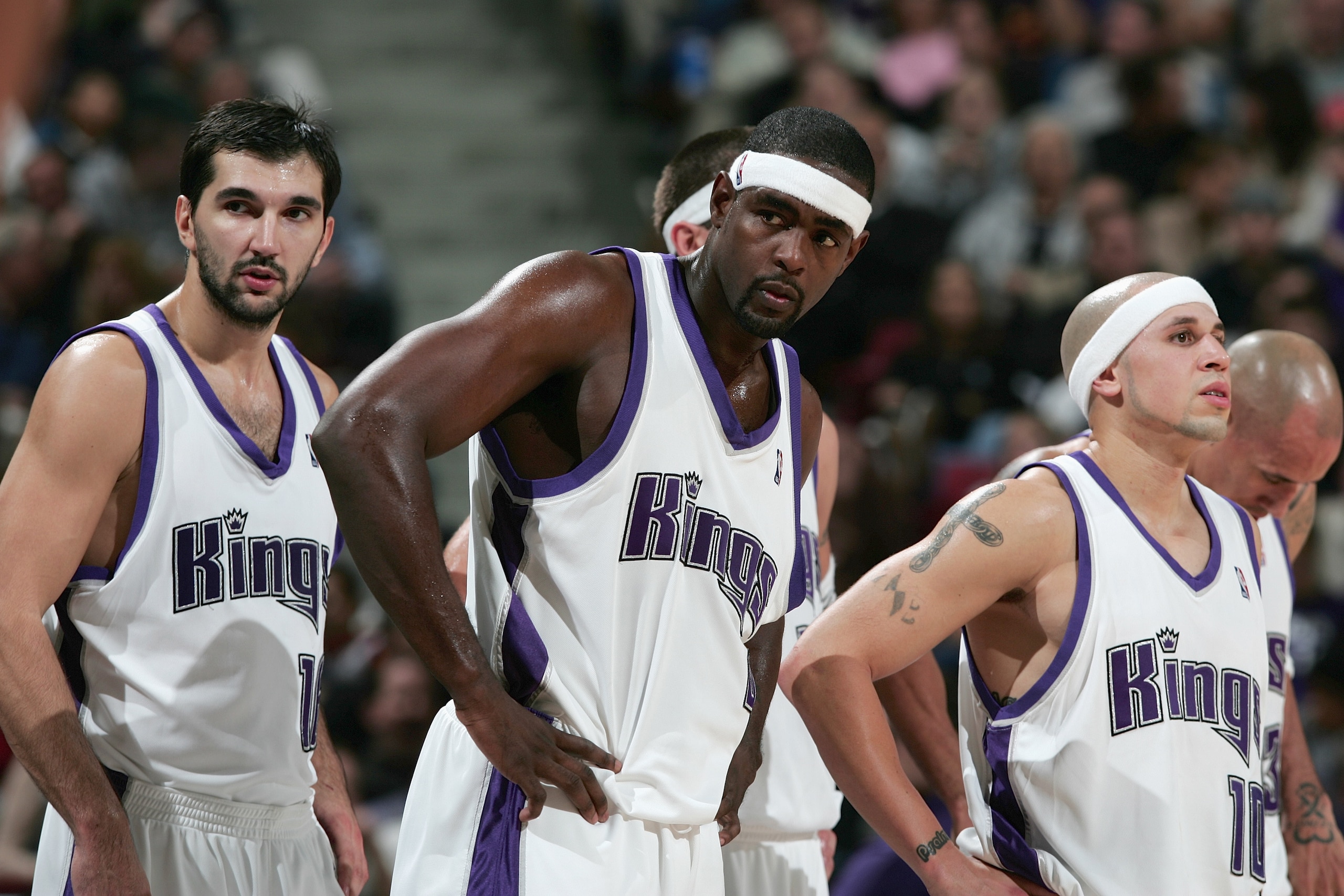 SACRAMENTO, CA - NOVEMBER 19:  Peja Stojakovic #16 of the Sacramento Kings stands next to his teammates Chris Webber #4 and Mike Bibby #10 during the game against the Memphis Gizzlies at Arco Arena on November 19, 2004 in Sacramento, California.  The King