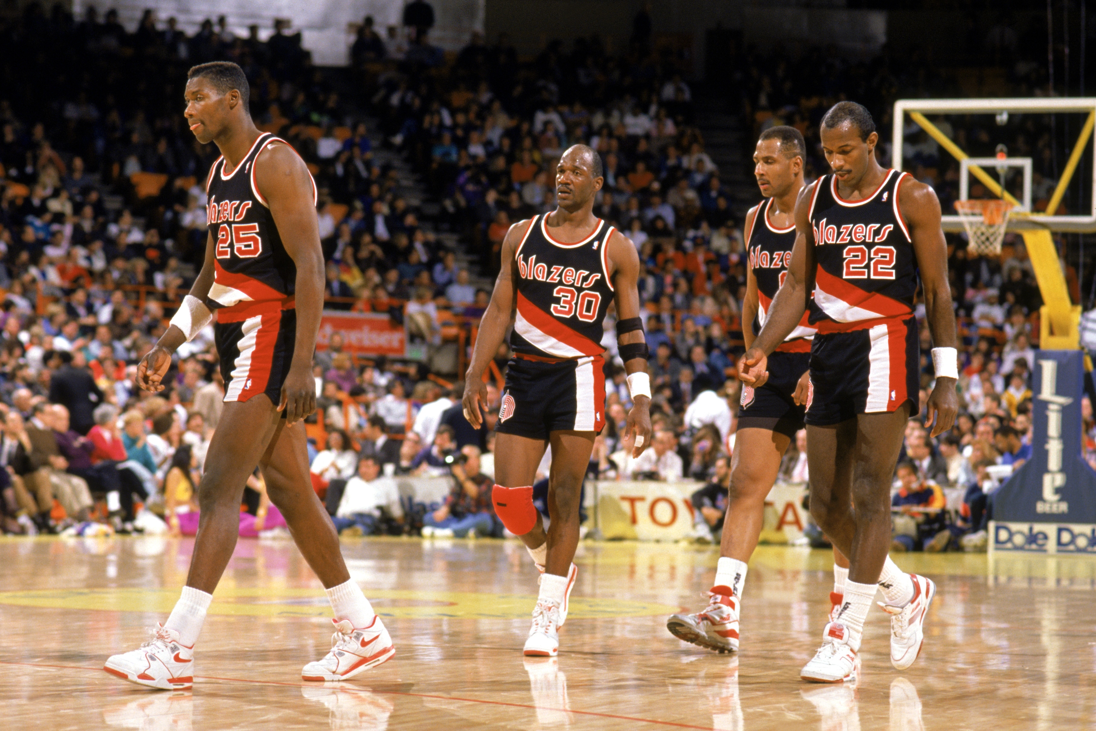 LOS ANGELES - 1990:  Jerome Kersey #25, Terry Porter #30, and Clyde Drexler #22 of the Portland Trail Blazers walk during the 1989-1990 NBA season game at the Great Western Forum in Los Angeles, California.  (Photo by Ken Levine/Getty Images)