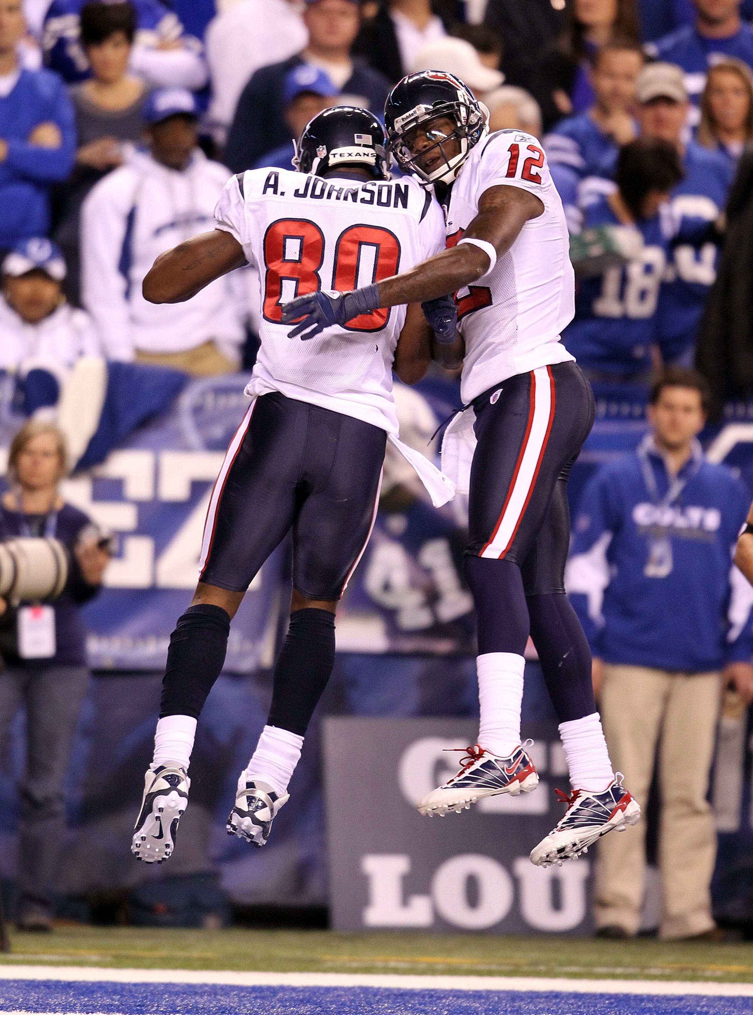 INDIANAPOLIS - NOVEMBER 01:  Andre Johnson #80 of Houston Texans celebrates with Jacoby Jones #12 after Johnson caught a touchdown pass during the NFL game against the Indianapolis Colts at Lucas Oil Stadium on November 1, 2010 in Indianapolis, Indiana.