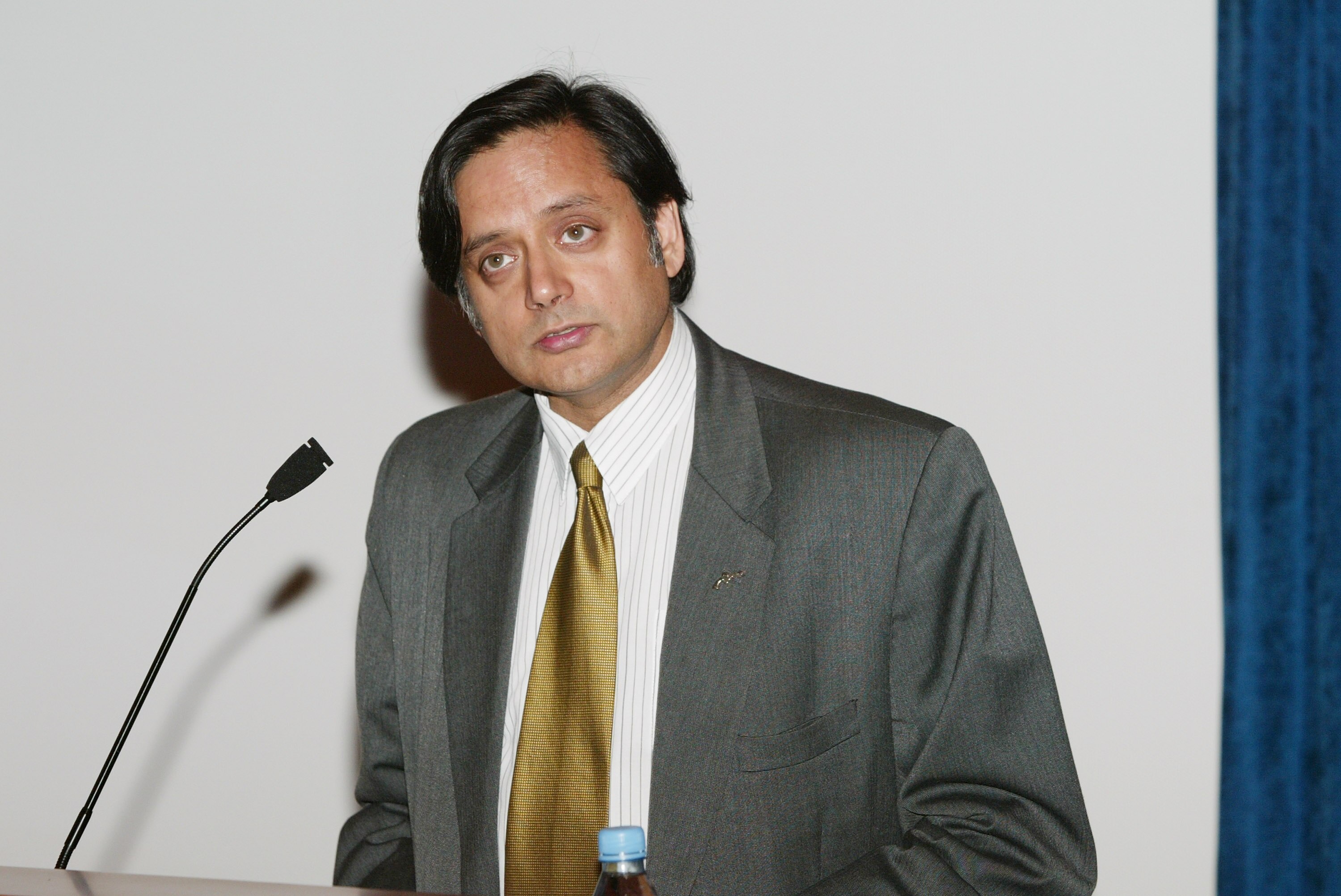 NEW YORK - AUGUST 20:  United Nations Undersecretary General Shashi Thraroor gives opening remarks at the 2003 U.S. Open Tennis Draw ceremony at the United Nations, Dag Hammarskjold Library August 20, 2003 in New York City.  (Photo by Evan Agostini/Getty