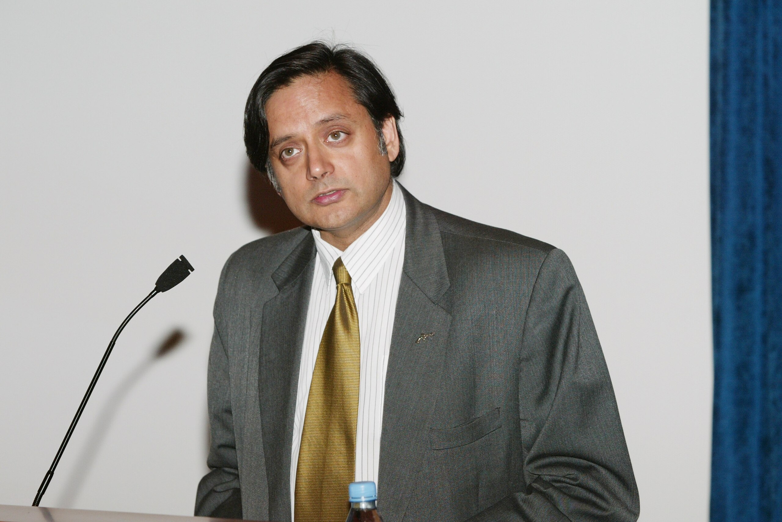 NEW YORK - AUGUST 20:  United Nations Undersecretary General Shashi Thraroor gives opening remarks at the 2003 U.S. Open Tennis Draw ceremony at the United Nations, Dag Hammarskjold Library August 20, 2003 in New York City.  (Photo by Evan Agostini/Getty
