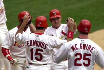 6 Apr 2000: J.D. Drew #7 of the St. Louis Cardinals is congratulated by teammates Fernando Tatis #23, Jim Edmonds #15 and Mark McGwire #25 after Drew hit a grand slam in the fourth inning against the Chicago Cubs at Busch Stadium in St. Louis, Missouri.DI