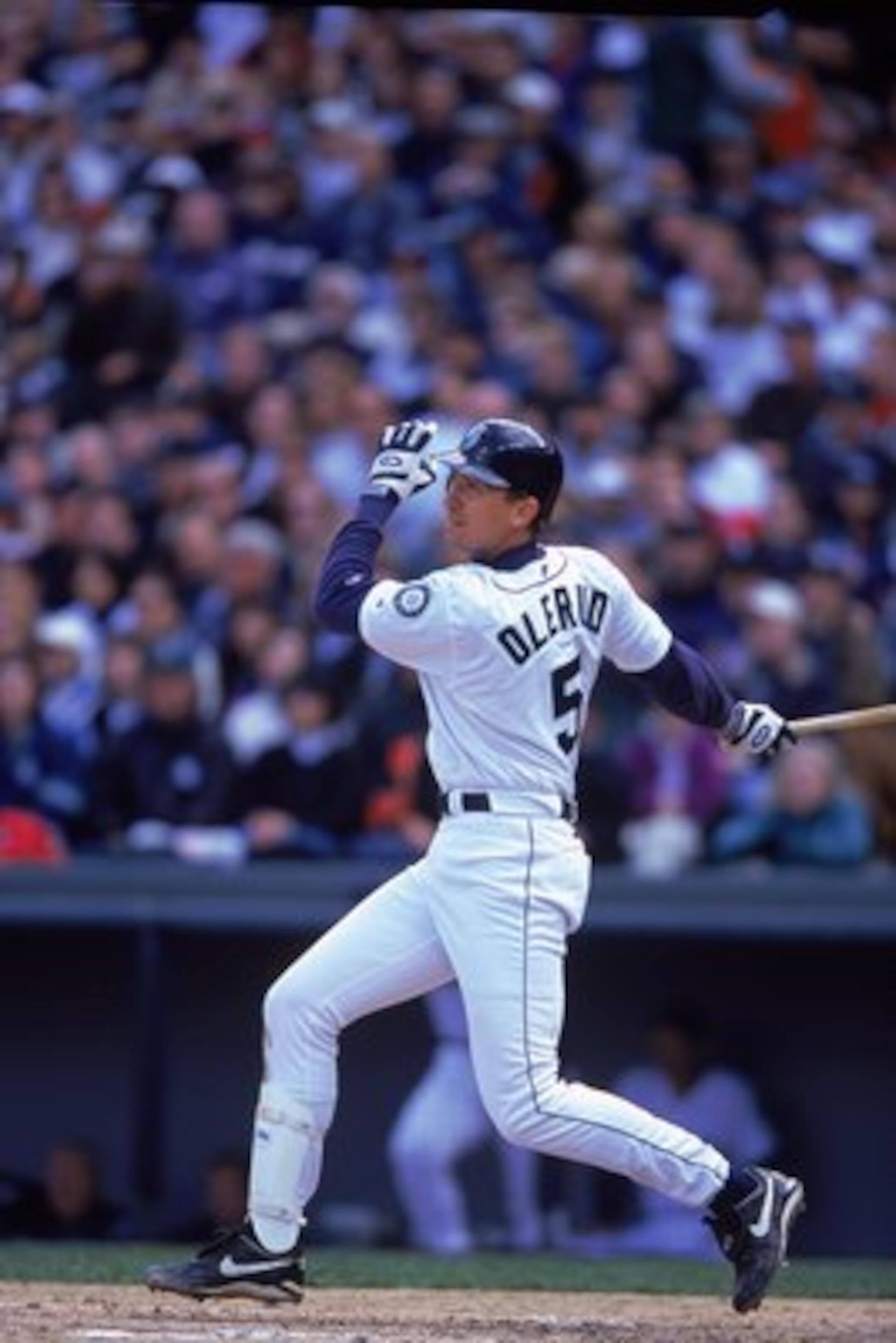9 Apr 2000: John Olerud #5 of the Seattle Mariners hits the ball during the game against the New York Yankees at Safeco Field in Seattle, Washington. The Mariners defeated the Yankees 9-3.