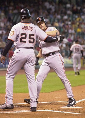 4 Oct 2001:  Barry Bonds #25 of the San Francisco Giants greets teammate Jeff Kent #21 at the plate after a 2 run homerun during the first inning against the Houston Astros at Enron Field in Houston, Texas. DIGITAL IMAGE  Mandatory Credit: Harry How/ALLSP
