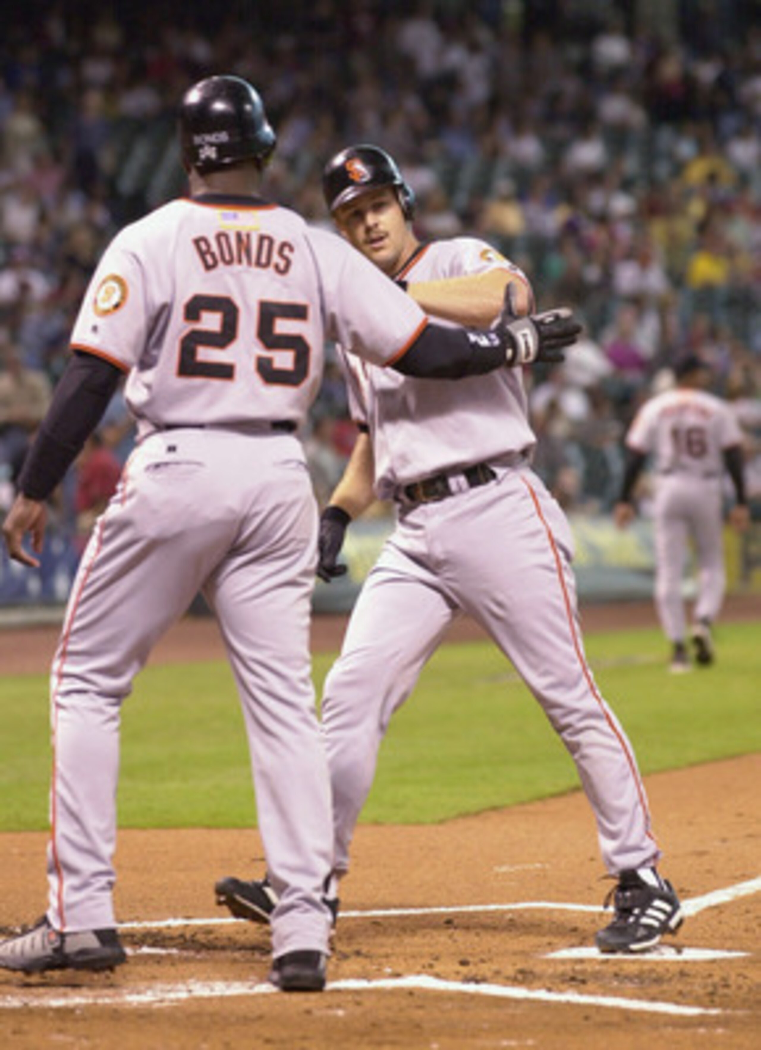 4 Oct 2001:  Barry Bonds #25 of the San Francisco Giants greets teammate Jeff Kent #21 at the plate after a 2 run homerun during the first inning against the Houston Astros at Enron Field in Houston, Texas. DIGITAL IMAGE  Mandatory Credit: Harry How/ALLSP