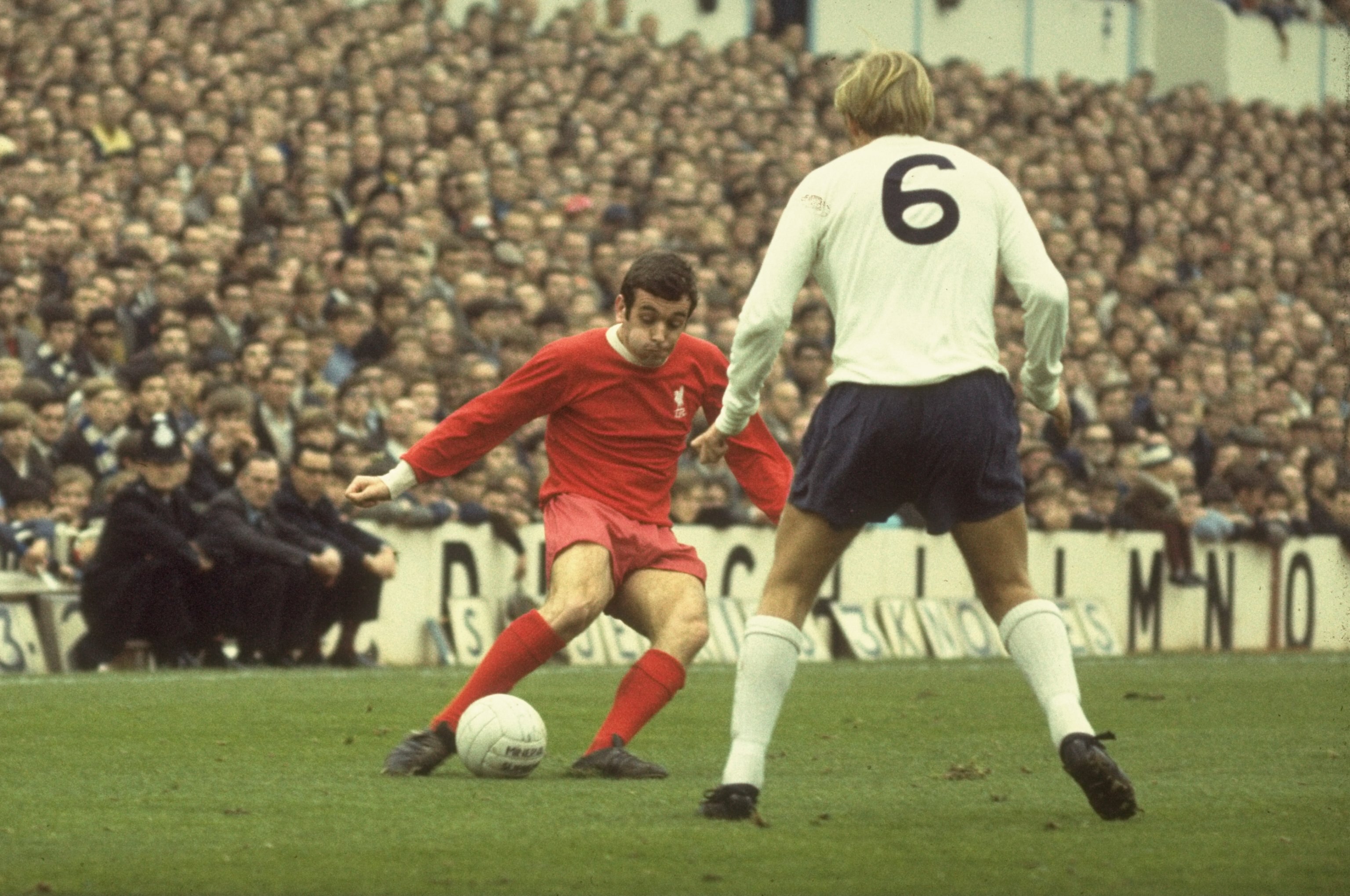 1969:  Ian Callaghan of Liverpool takes on Phil Beale #6 of Tottenham Hotspur during a Football League Division One match at White Hart Lane in London.  \ Mandatory Credit: Allsport UK /Allsport