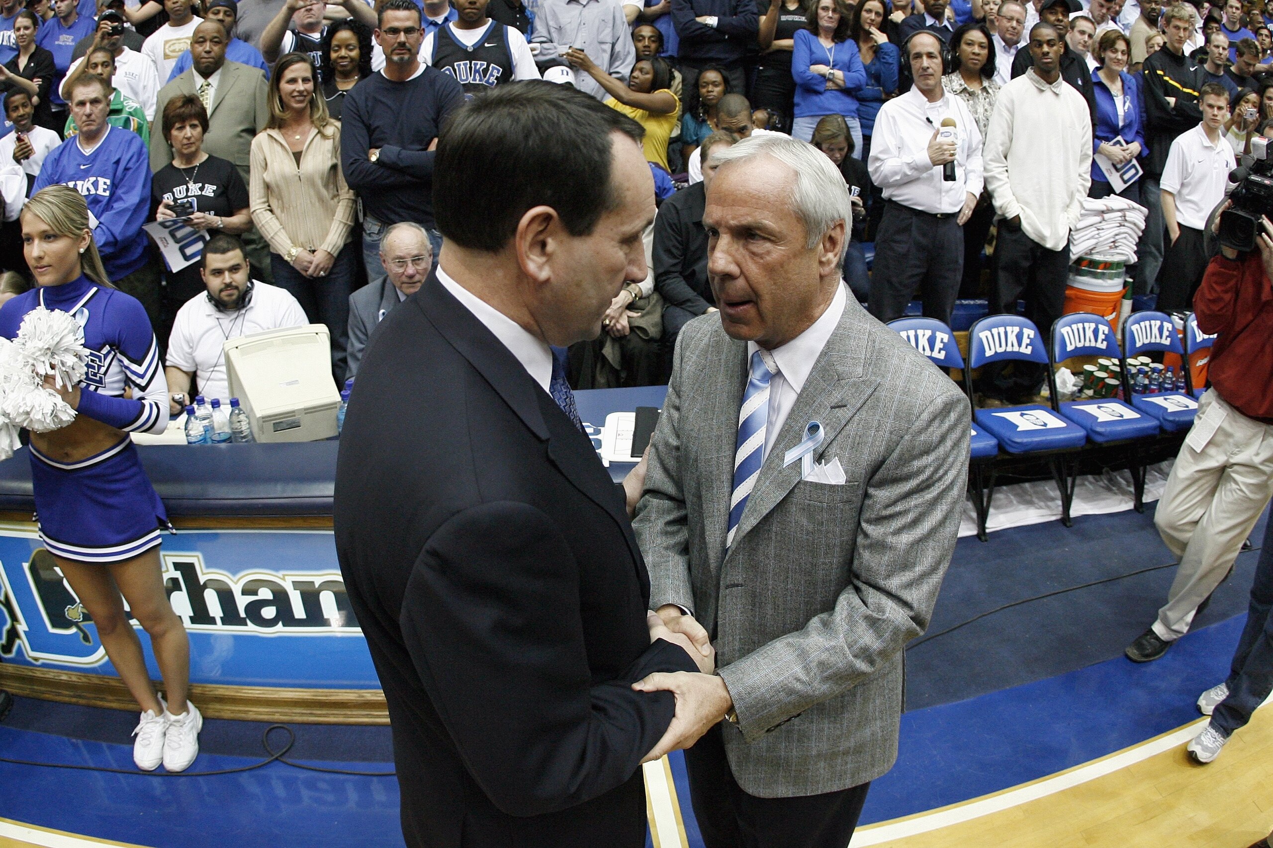 DURHAM, NC - MARCH 8: Head coach Mike Krzyzewski (L) of the Duke Blue Devils shakes hands with head coach Roy Williams of the North Carolina Tar Heels before their game at Cameron Indoor Stadium March 8, 2008 in Durham, North Carolina. (Photo by Kevin C. DURHAM, NC - MARCH 8: Head coach Mike Krzyzewski (L) of the Duke Blue Devils shakes hands with head coach Roy Williams of the North Carolina Tar Heels before their game at Cameron Indoor Stadium March 8, 2008 in Durham, North Carolina. (Photo by Kevin C.
