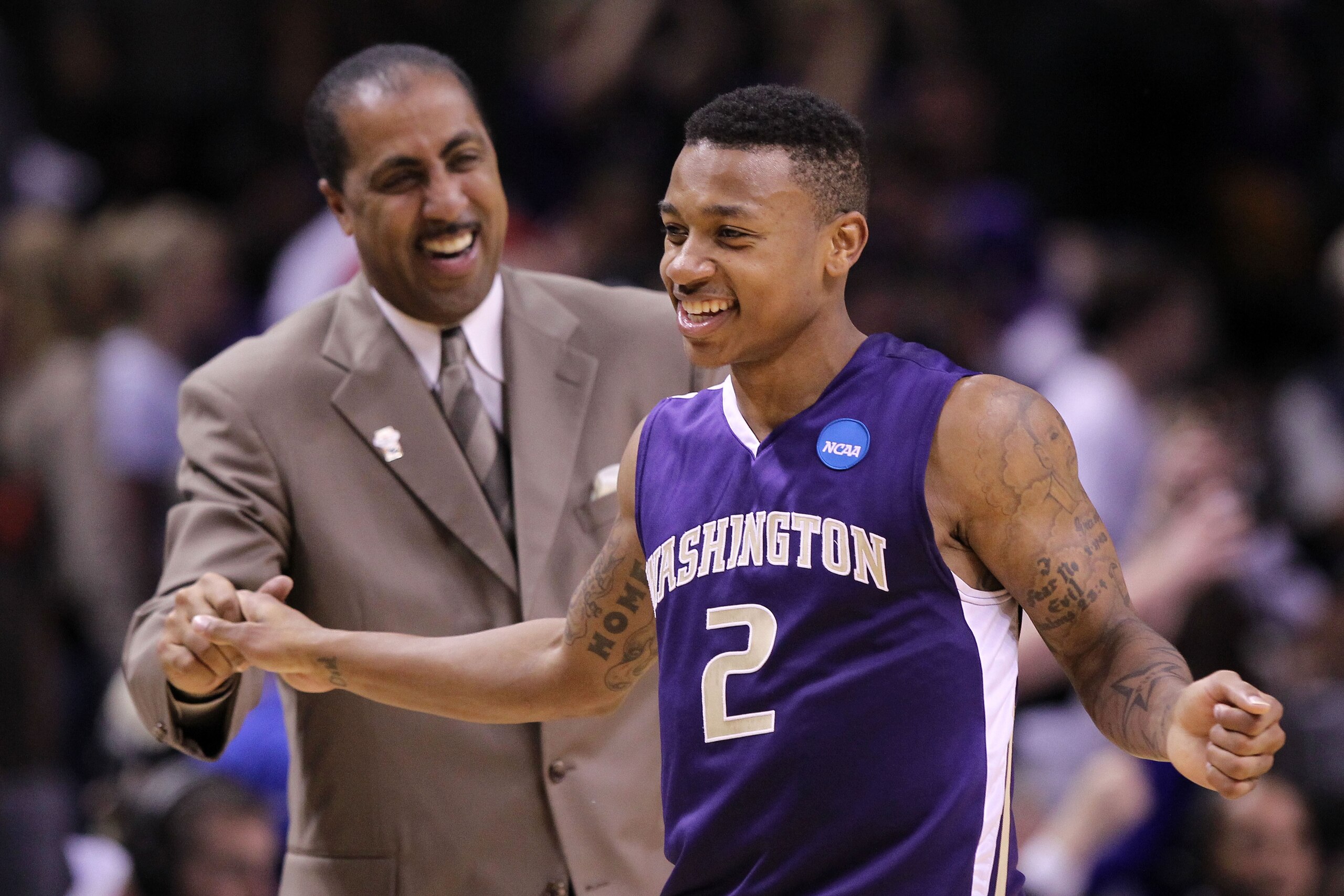 SAN JOSE, CA - MARCH 20: Guard Isaiah Thomas #2 and head coach Lorenzo Romar of the Washington Huskies celebrate after their 82-64 win over the New Mexico Lobos in the second round of the 2010 NCAA men's basketball tournament at HP Pavilion on March 20, SAN JOSE, CA - MARCH 20: Guard Isaiah Thomas #2 and head coach Lorenzo Romar of the Washington Huskies celebrate after their 82-64 win over the New Mexico Lobos in the second round of the 2010 NCAA men's basketball tournament at HP Pavilion on March 20,