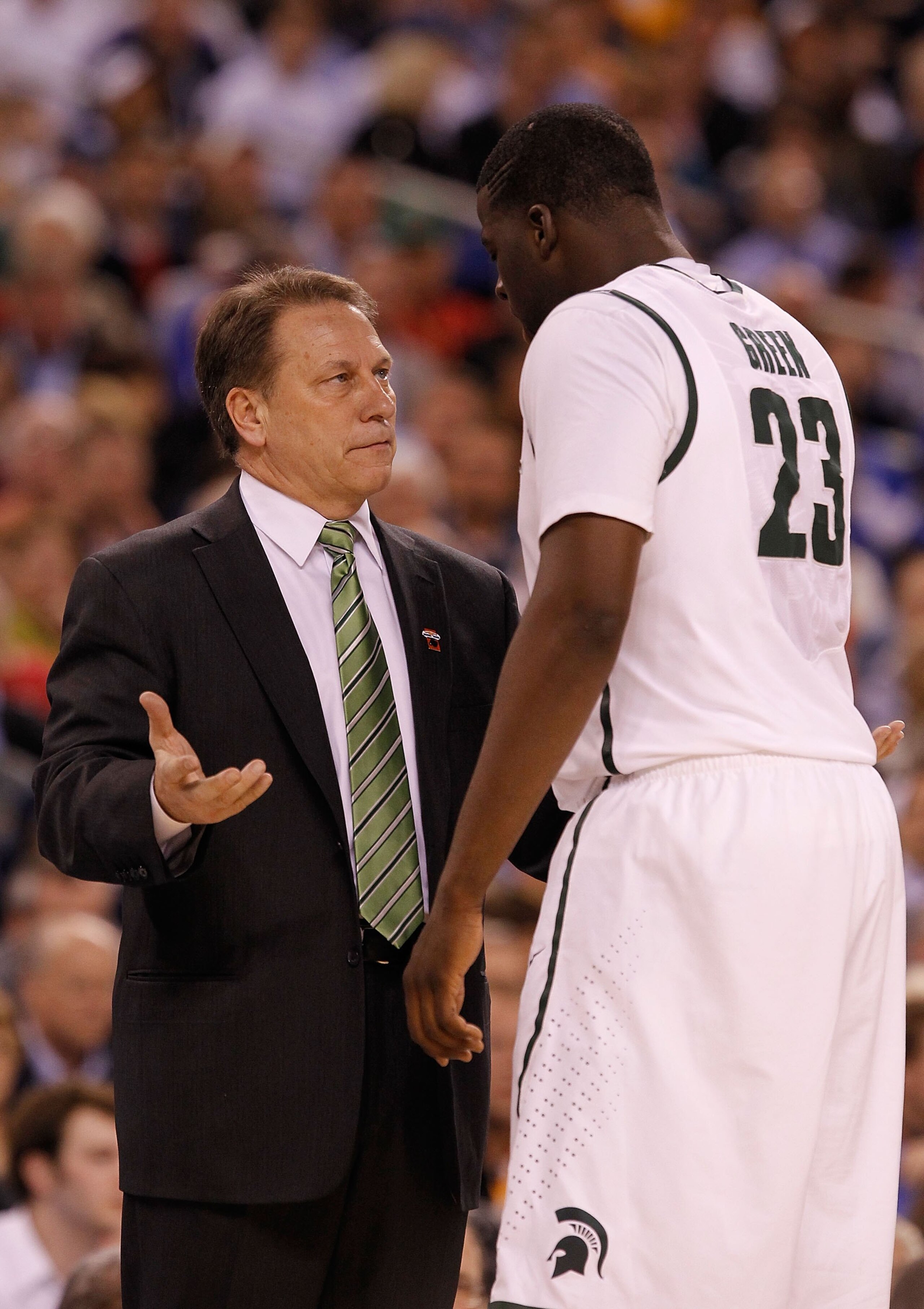 INDIANAPOLIS - APRIL 03: Head coach Tom Izzo of the Michigan State Spartans talks with Draymond Green #23 from the sideline while taking on the Butler Bulldogs during the National Semifinal game of the 2010 NCAA Division I Men's Basketball Championship o INDIANAPOLIS - APRIL 03: Head coach Tom Izzo of the Michigan State Spartans talks with Draymond Green #23 from the sideline while taking on the Butler Bulldogs during the National Semifinal game of the 2010 NCAA Division I Men's Basketball Championship o