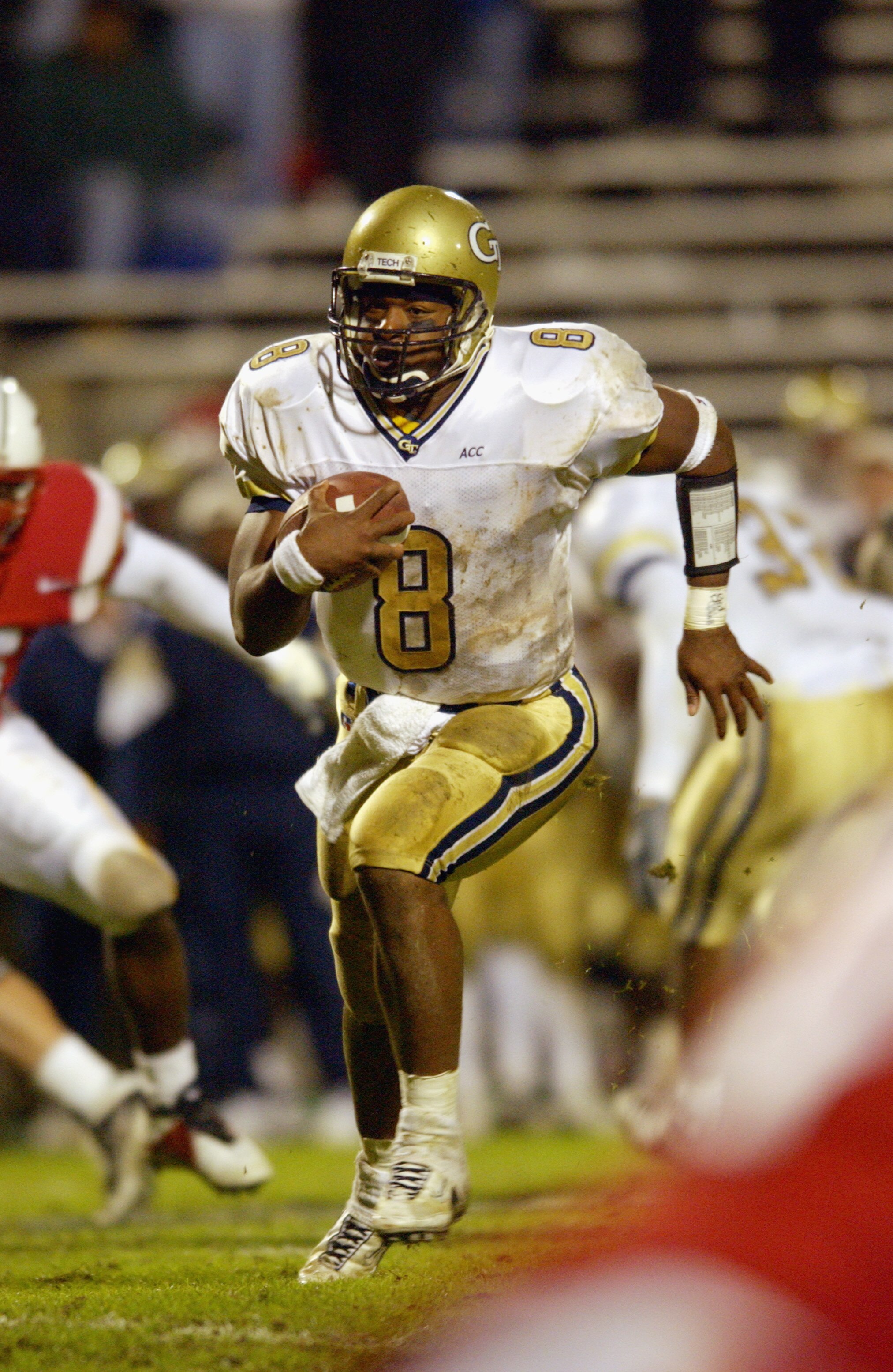 COLLEGE PARK, MD - OCTOBER 17:  Quarterback Damarius Bilbo #8 of the Georgia Tech Yellow Jackets runs the ball during the game against the University of Maryland Terrapins   on October 17, 2002 at Byrd Stadium in College Park, Maryland.  Maryland defeats