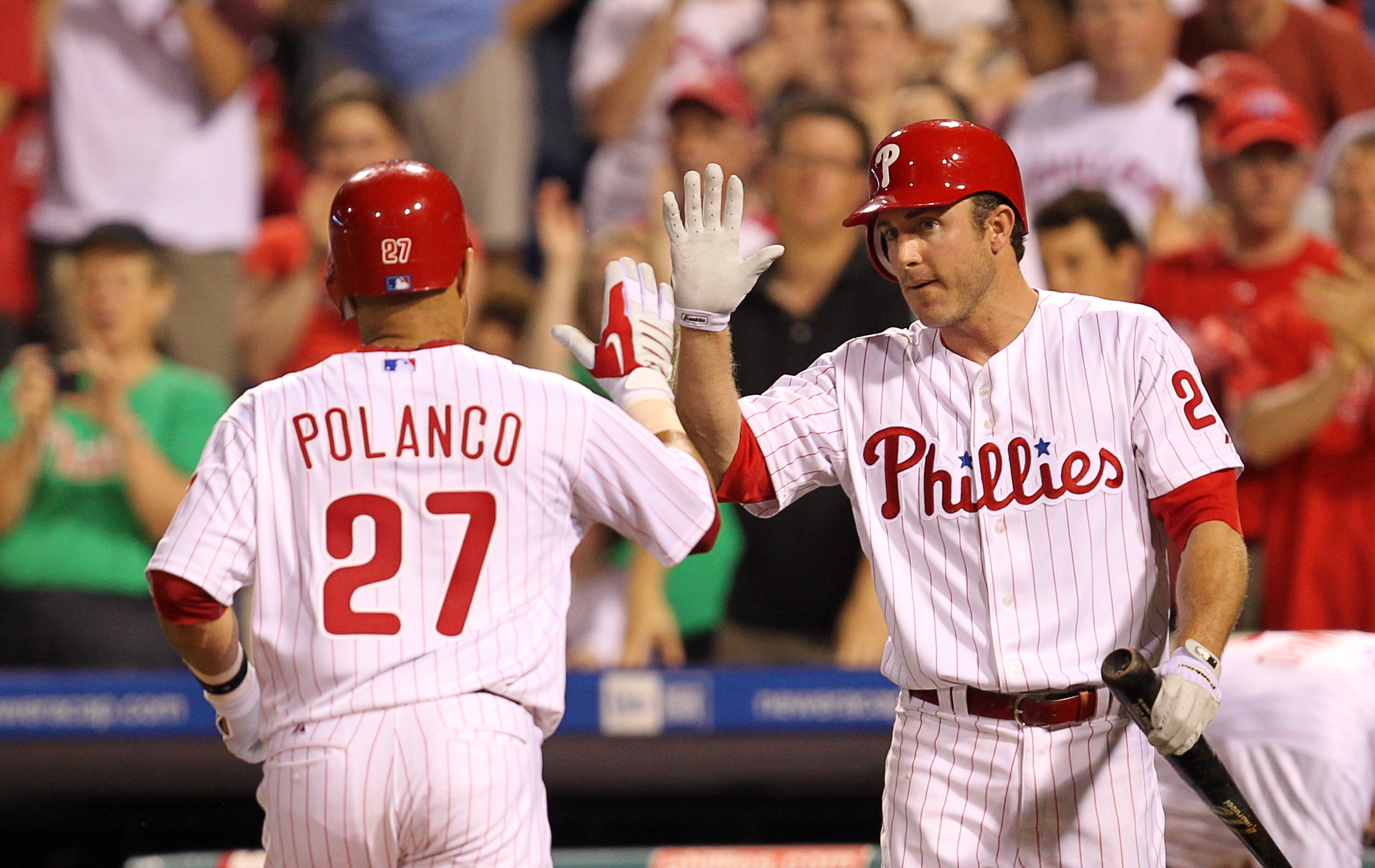 PHILADELPHIA - MAY 2: Third baseman Placido Polanco #27 is greeted by second baseman Chase Utley #26 of the Philadelphia Phillies after hitting a home run during a game against the New York Mets at Citizens Bank Park on May 2, 2010 in Philadelphia, Pennsy